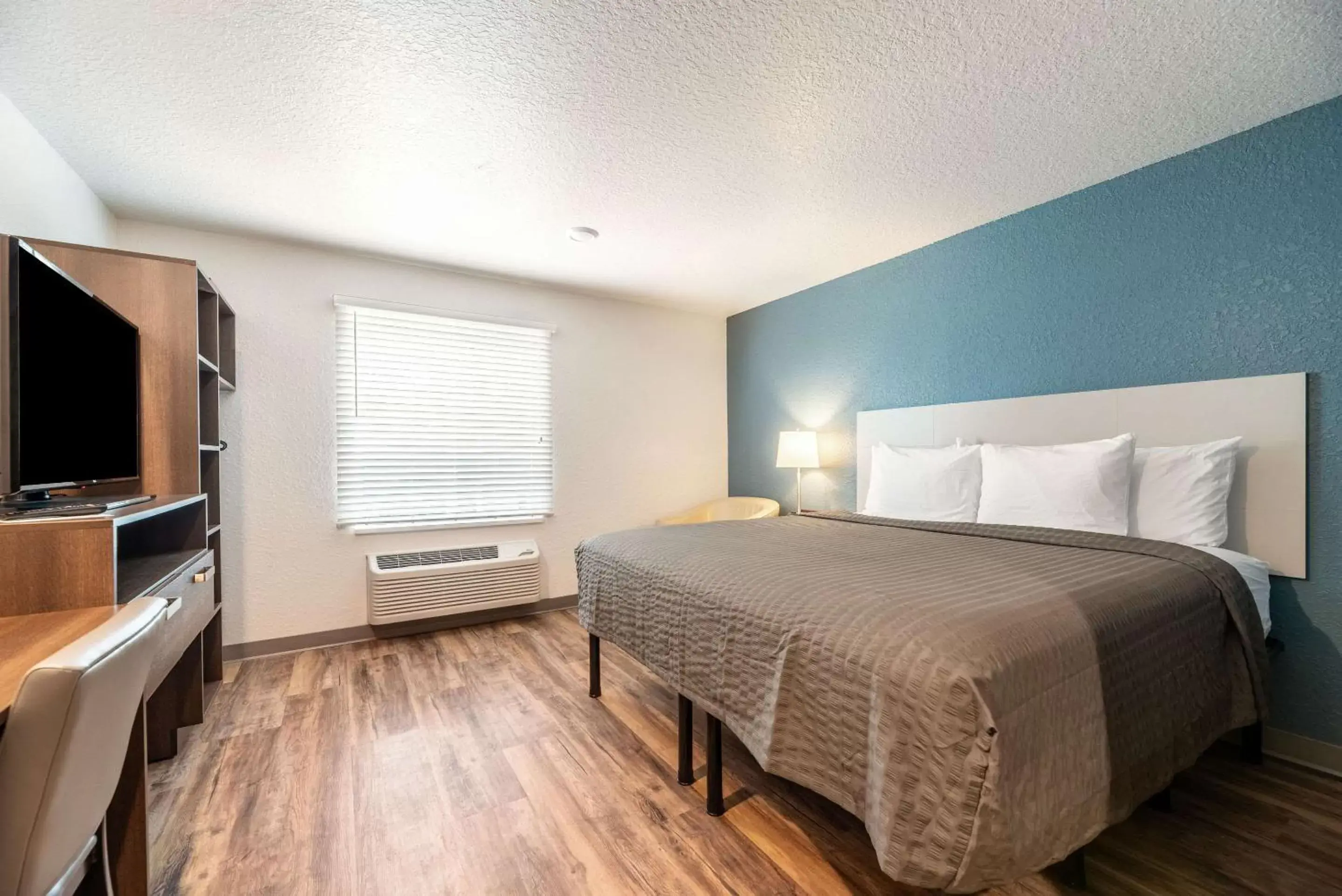 Photo of the whole room, Bed in WoodSpring Suites Sanford North I-4 Orlando Area