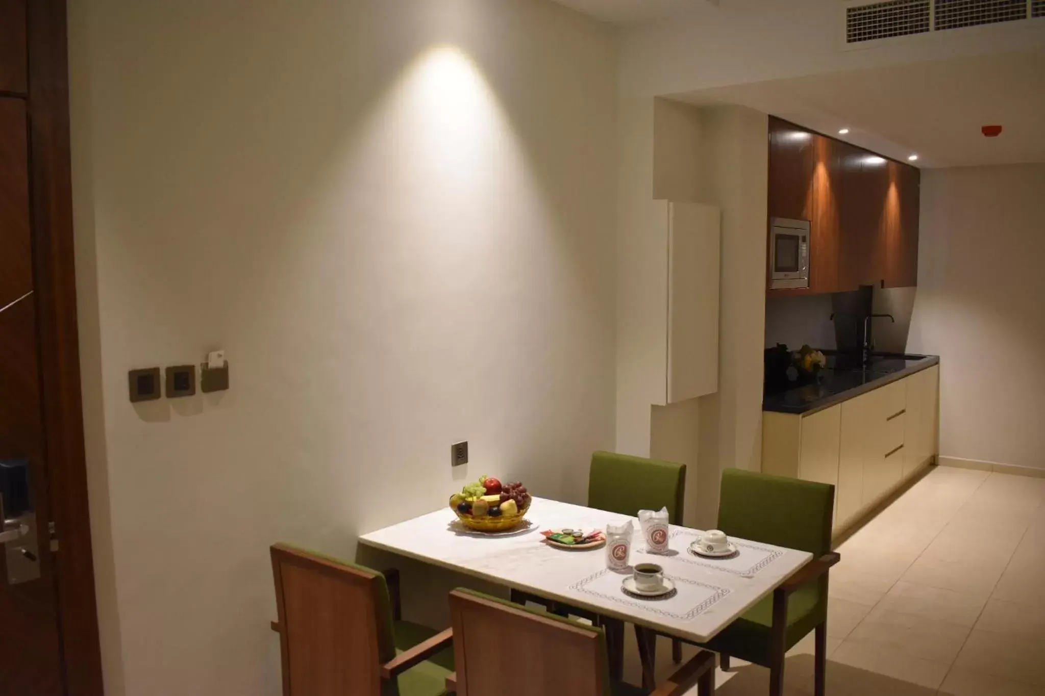 Kitchen or kitchenette, Dining Area in Ramee Palace Hotel