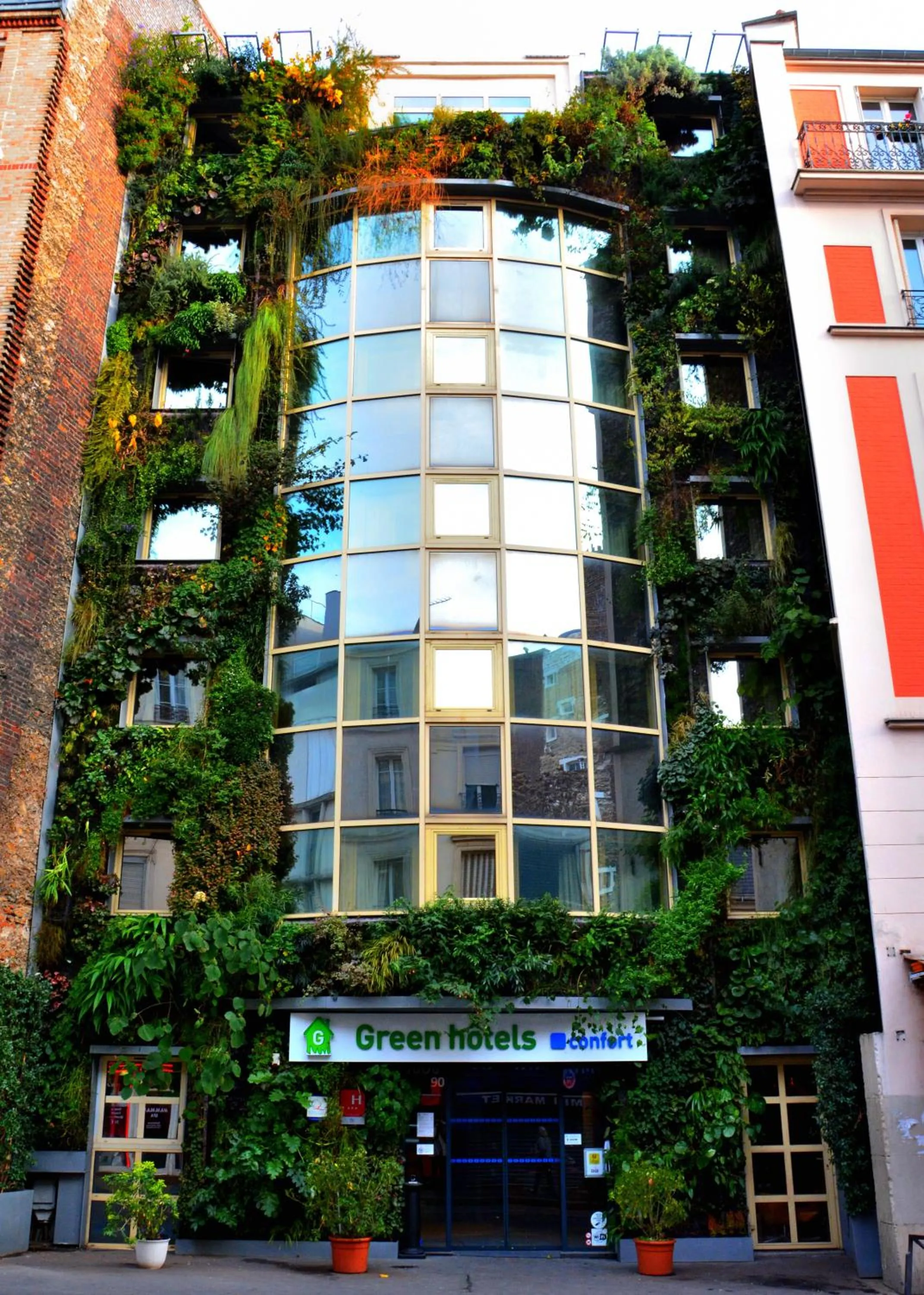 Property building in Green hotels Confort Paris 13