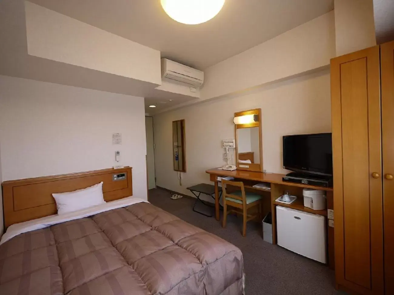 Bed in Hotel Route-Inn Mooka