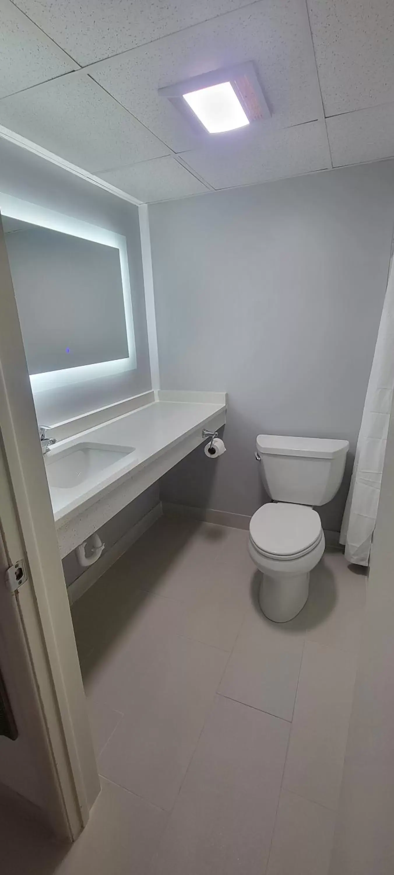 Toilet, Bathroom in Royal Inn & Suites