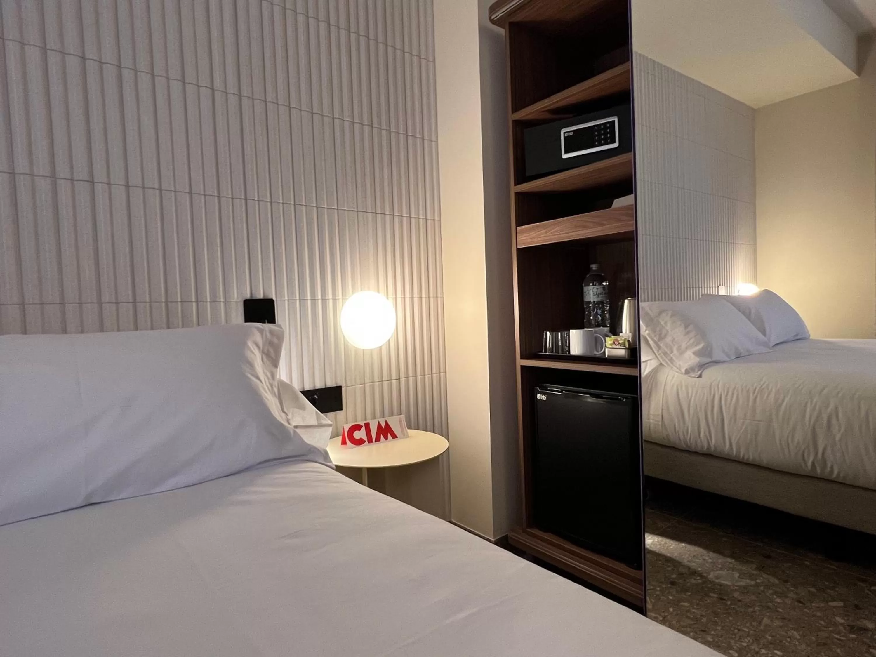 Bed in CIM HOTEL BOUTIQUE