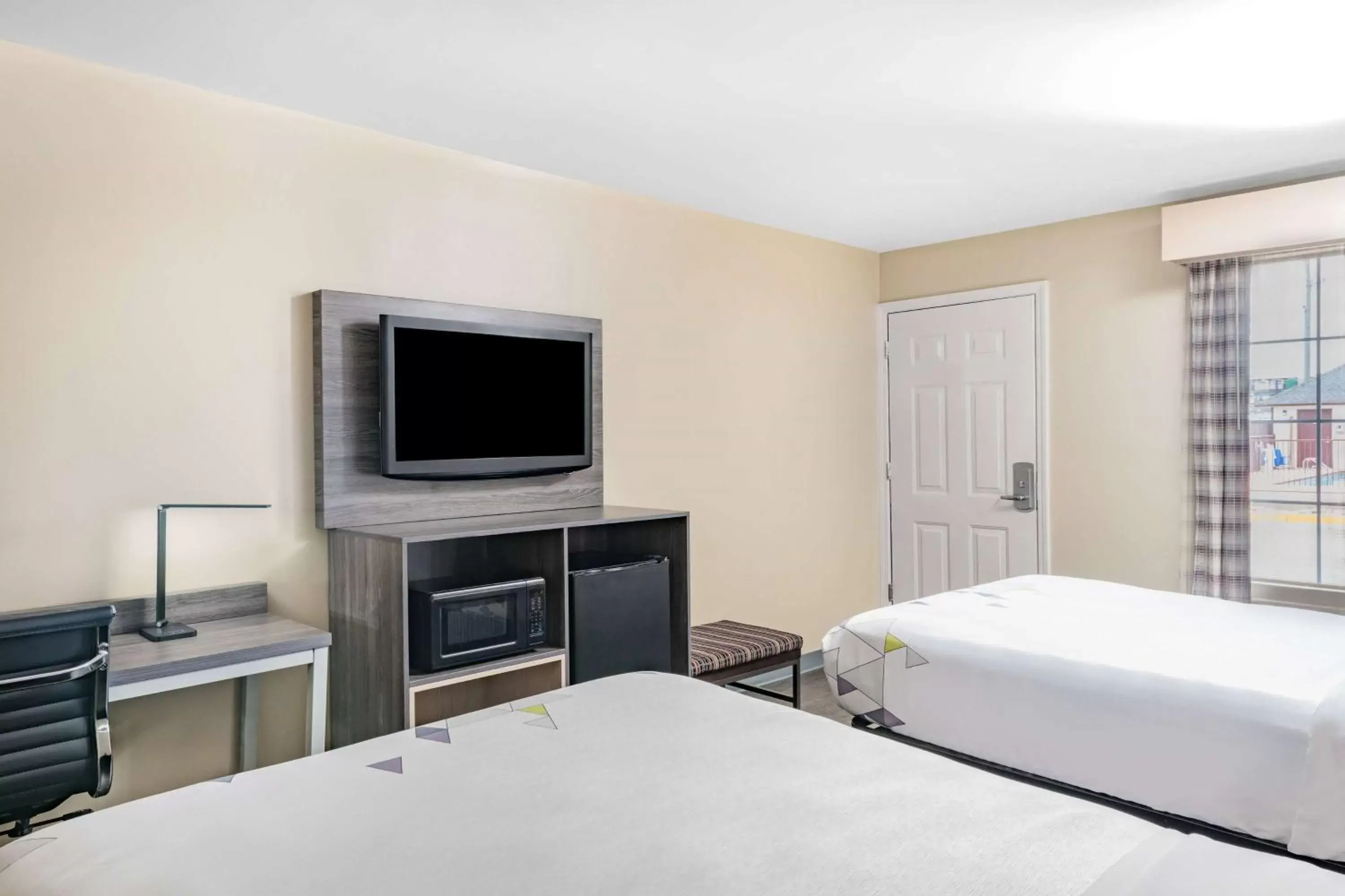Bed in Baymont by Wyndham Commerce GA Near Tanger Outlets Mall