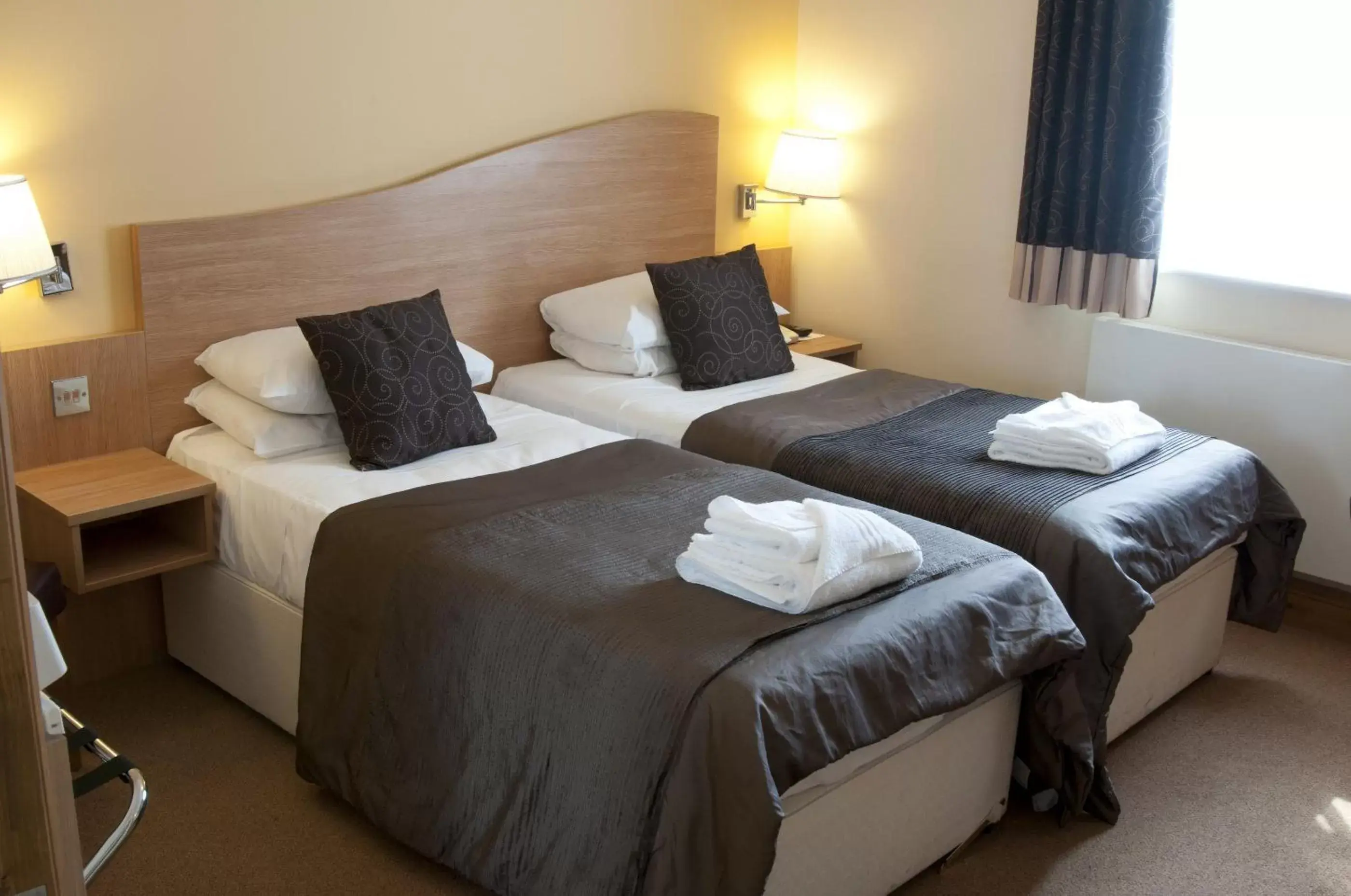 Bed in The Queensgate Hotel