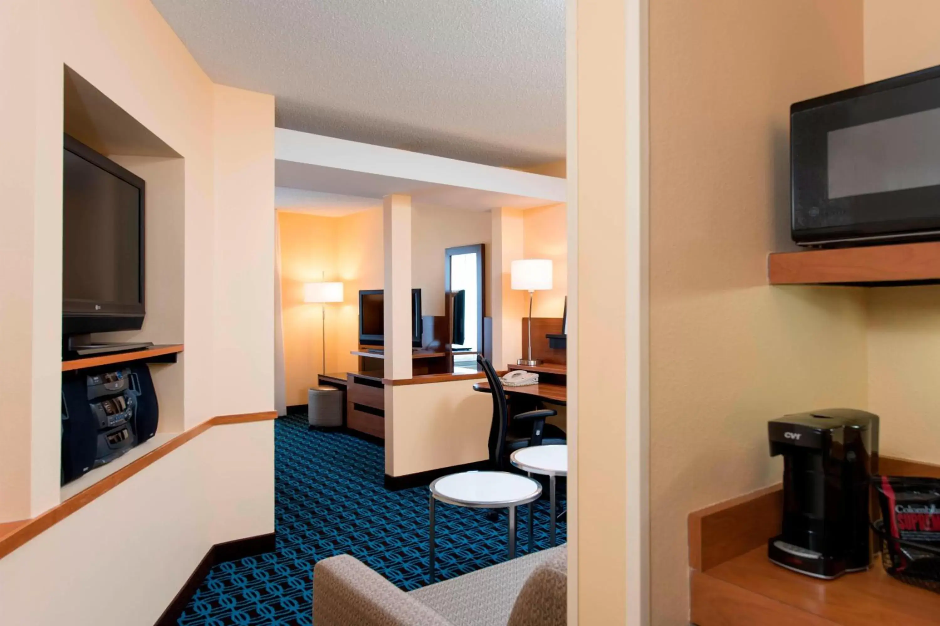 Photo of the whole room, TV/Entertainment Center in Fairfield Inn and Suites by Marriott Chicago St. Charles