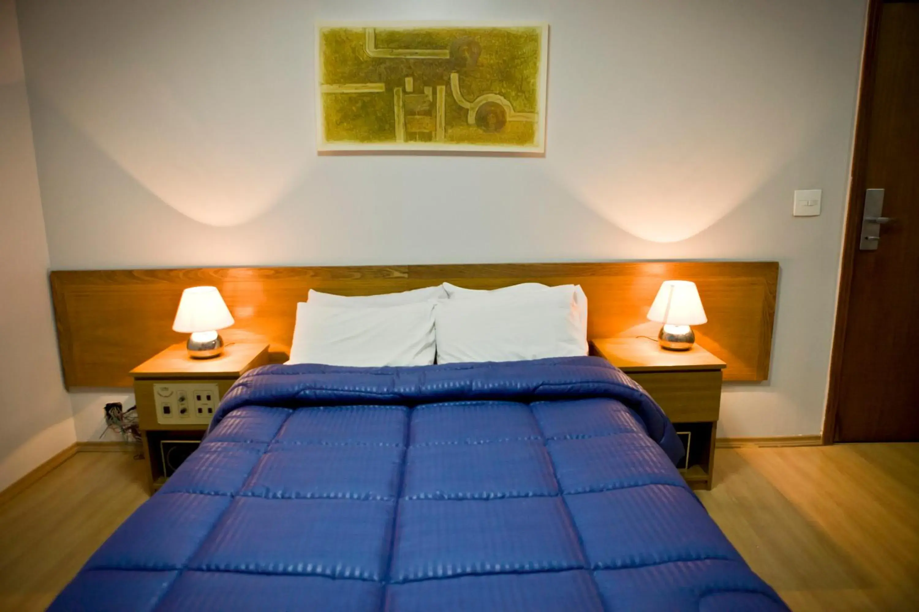 Bed in Carillon Plaza Hotel