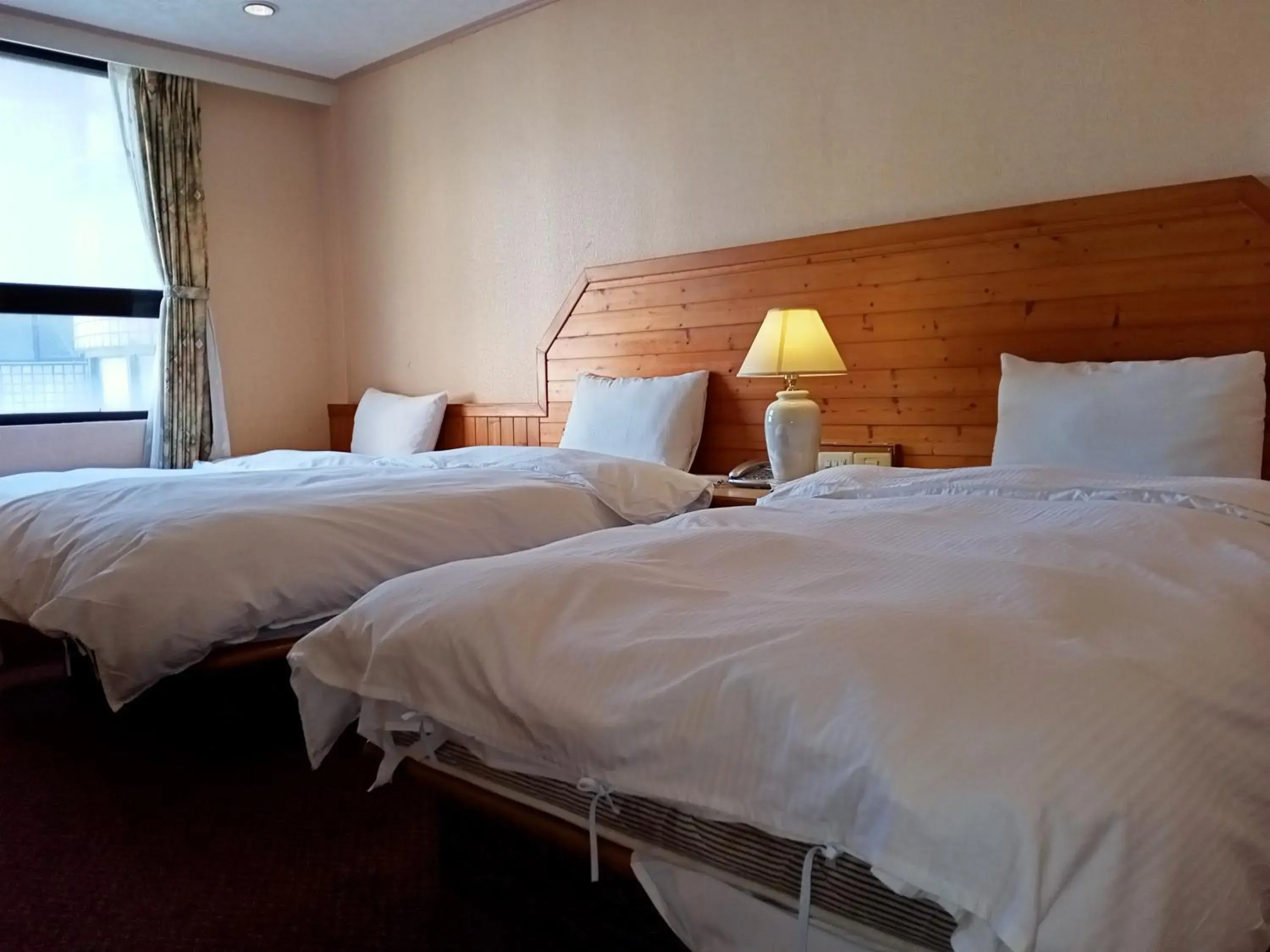 Bed in Chungli Business Hotel