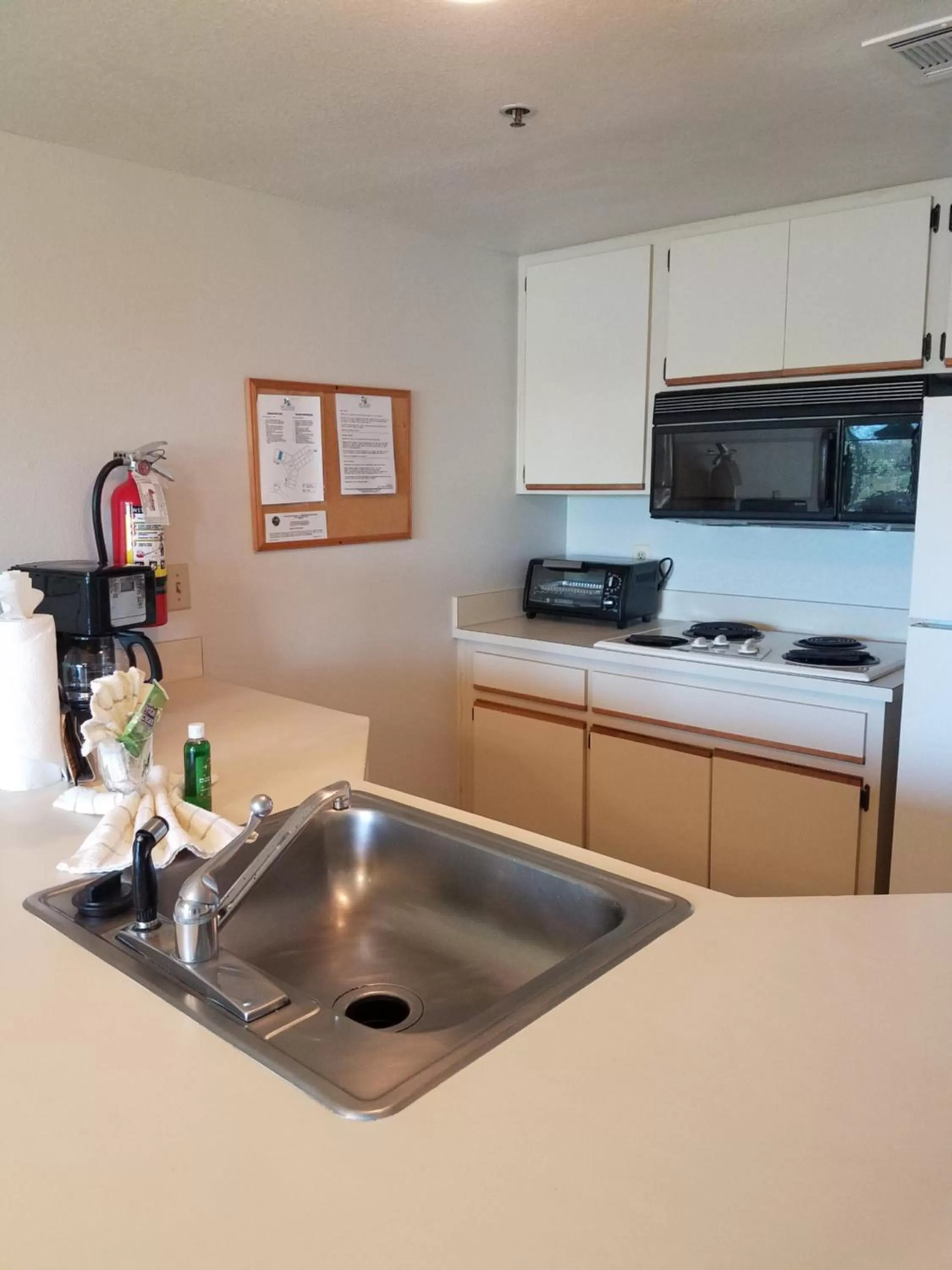 Kitchen or kitchenette in Parc Corniche Condominium Suites