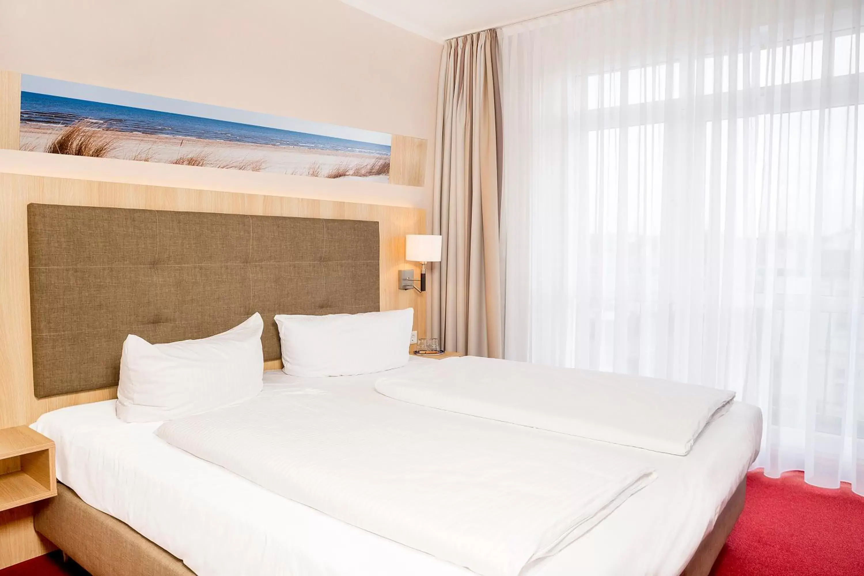 Bed in Garni Eden Hotels