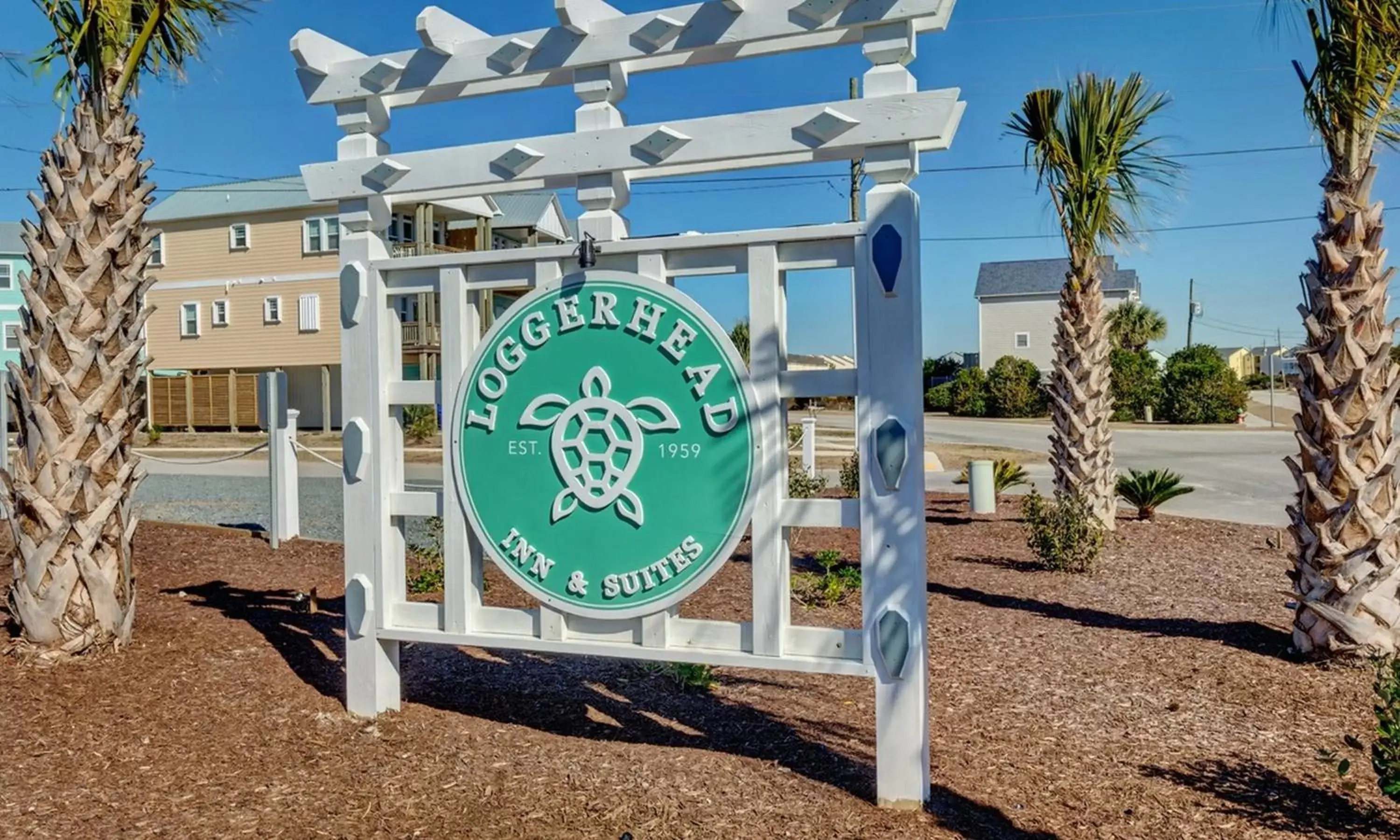 Property logo or sign in Loggerhead Inn and Suites by Carolina Retreats