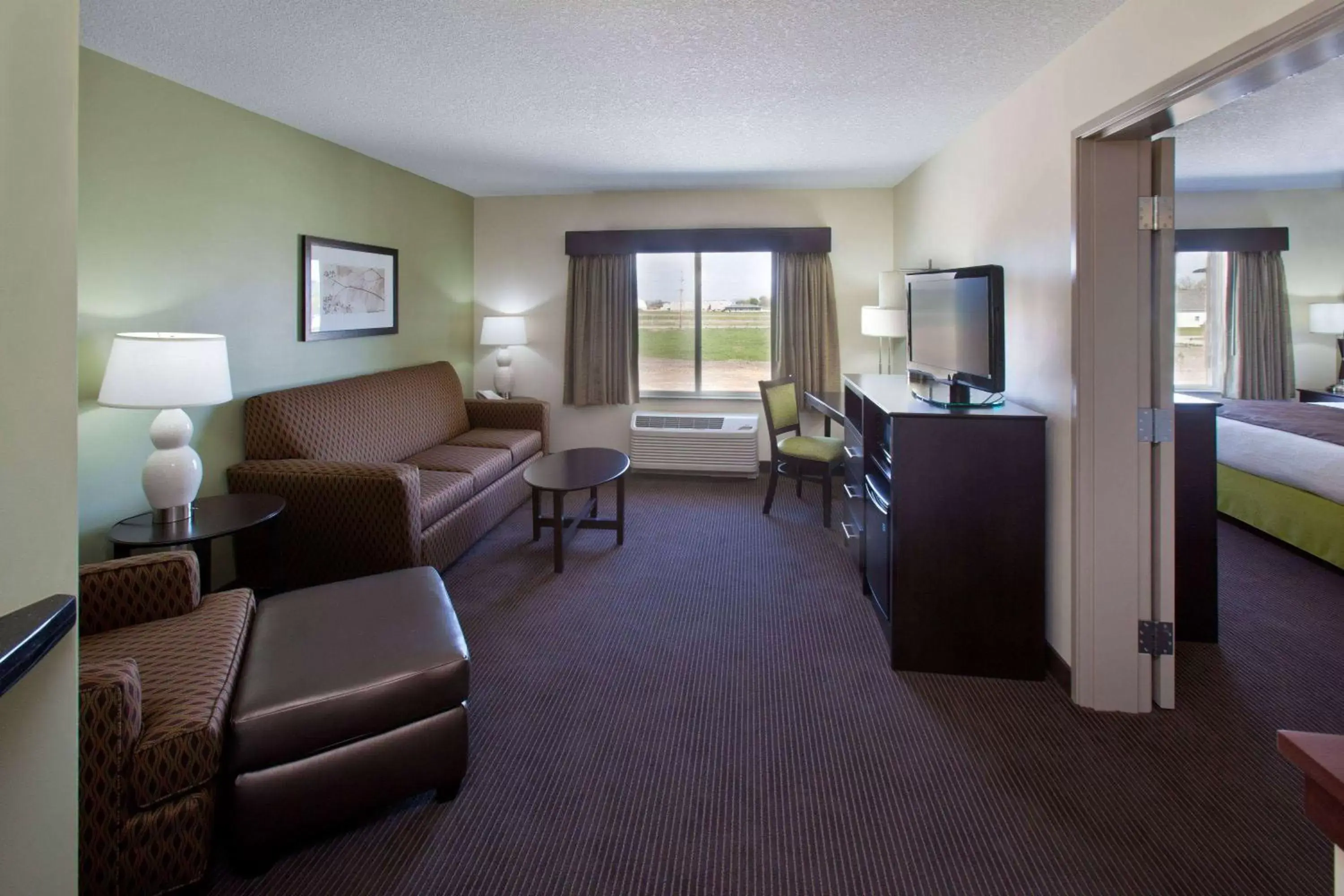 Living room, Seating Area in AmericInn by Wyndham Fairfield