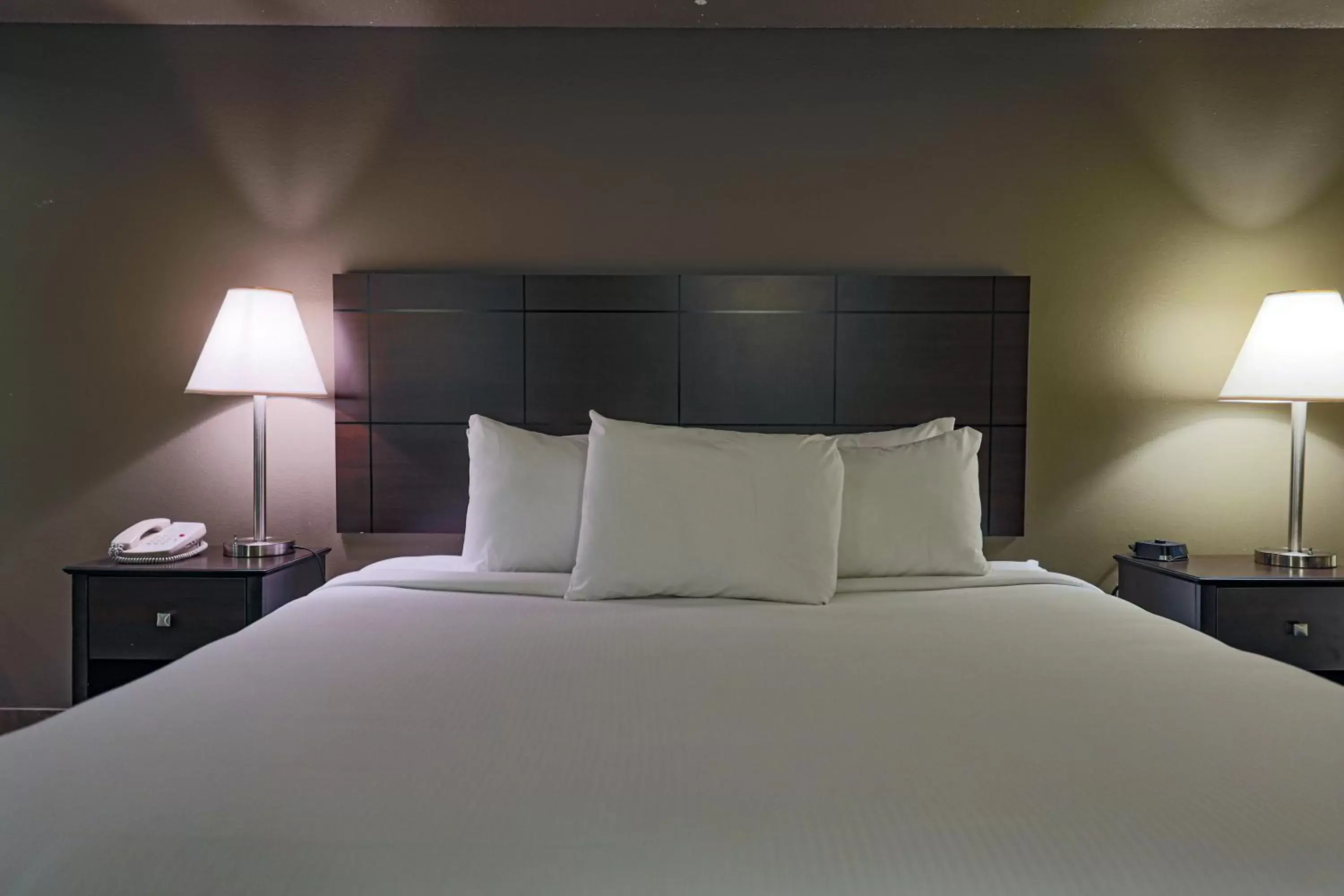 Bed in AmericInn by Wyndham Lincoln South