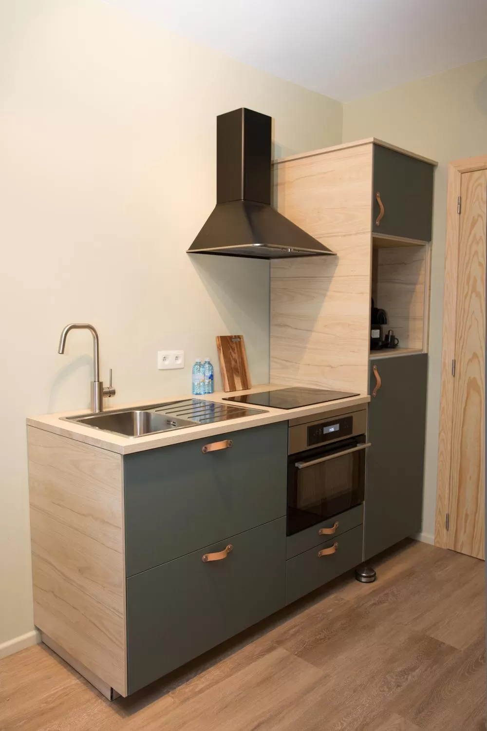 Kitchen or kitchenette in Appart hôtel En Ville