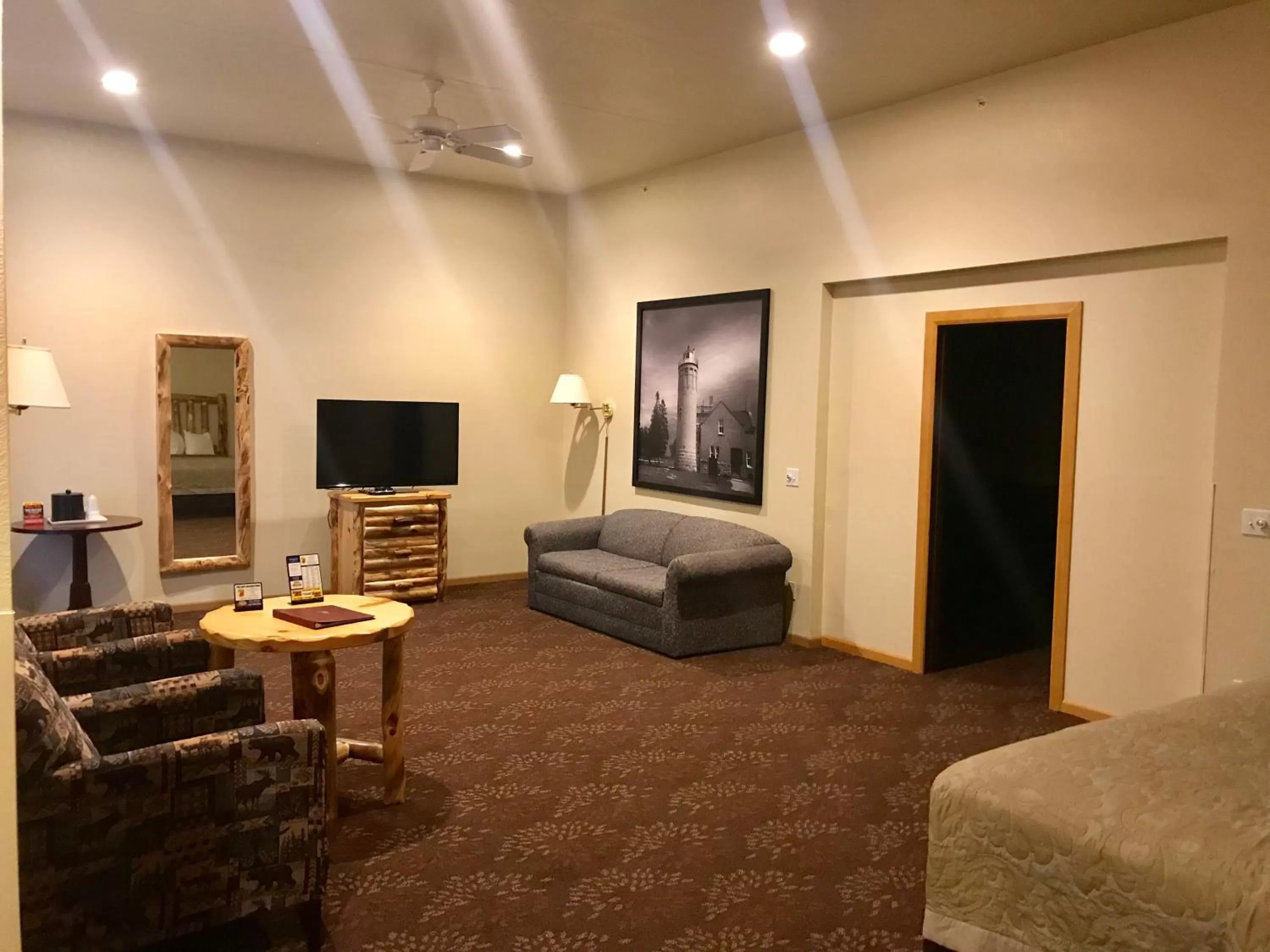 Seating area, Bed in Super 8 by Wyndham Bridgeview of Mackinaw City