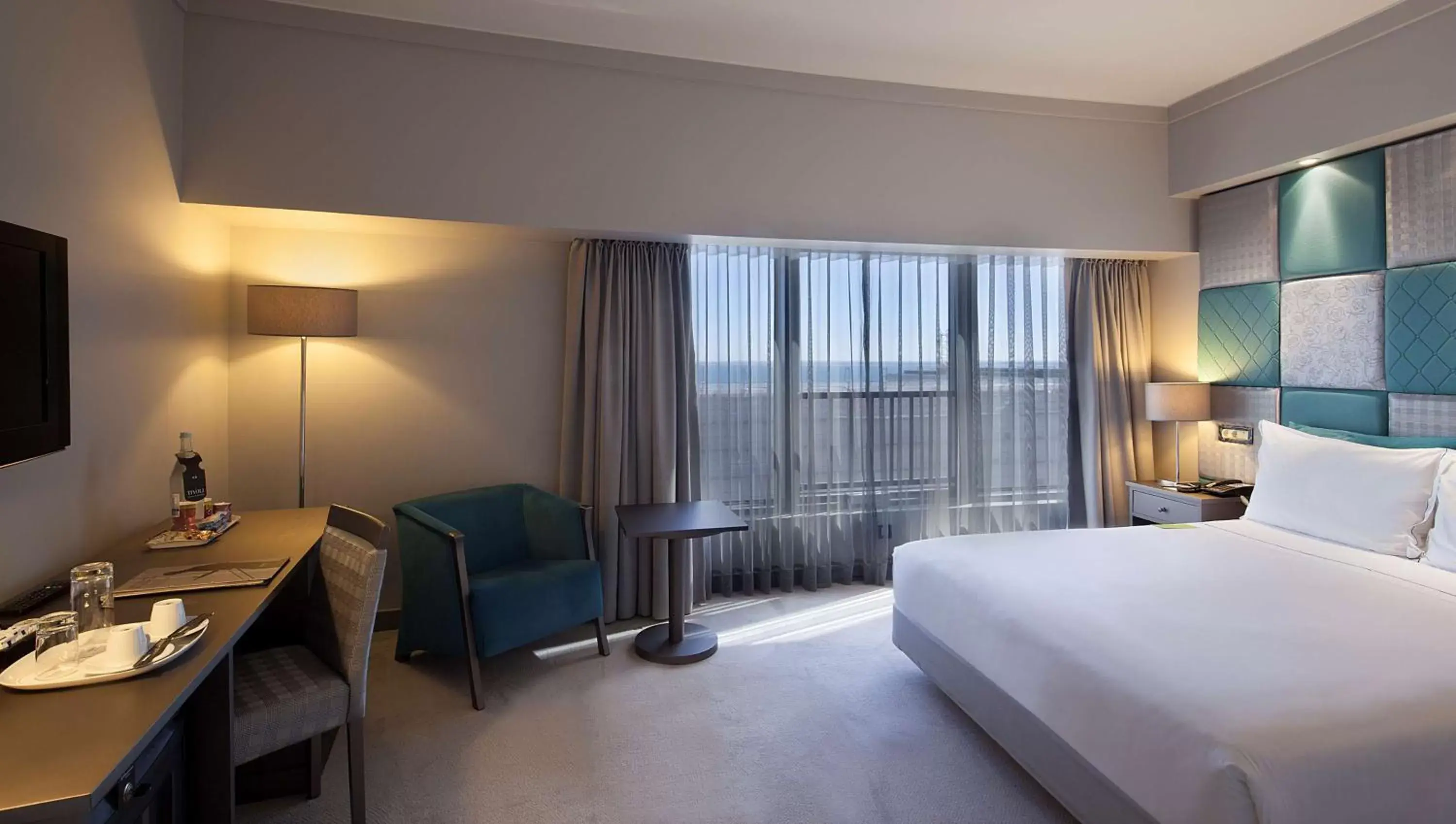 Photo of the whole room, Bed in Tivoli Oriente Lisboa Hotel
