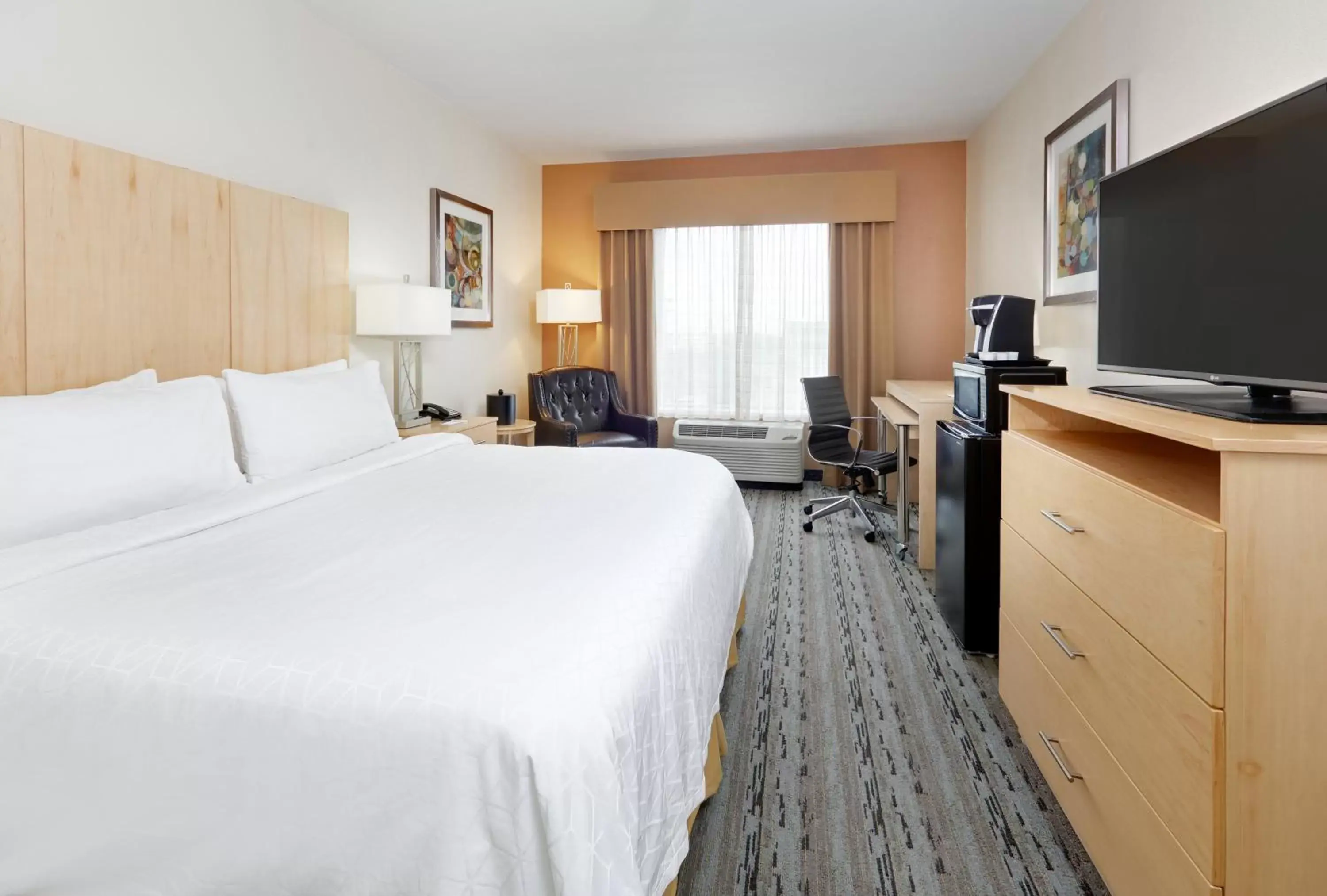 Photo of the whole room, TV/Entertainment Center in Holiday Inn Express & Suites San Antonio Brooks City Base, an IHG Hotel