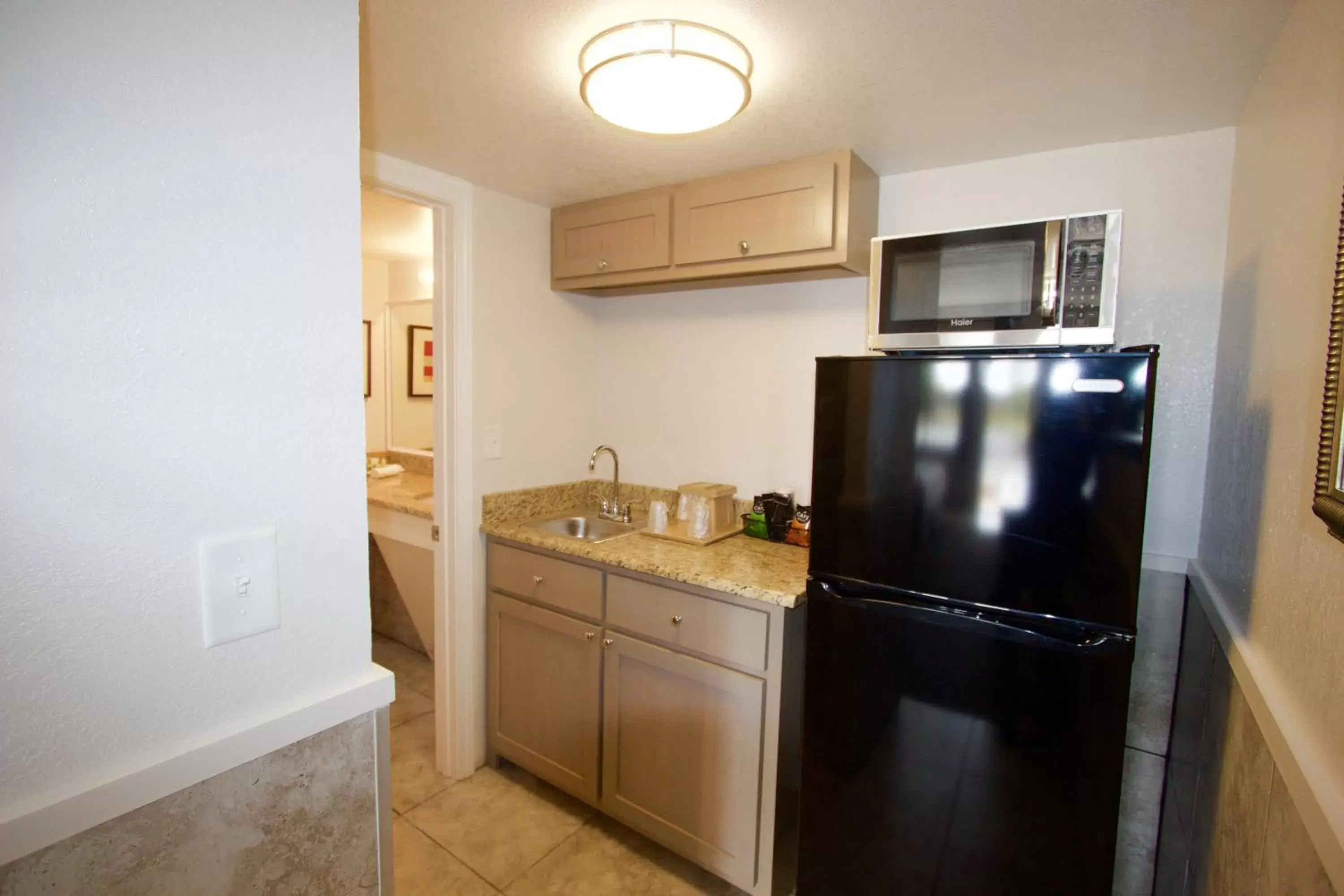 Property building, Kitchen/Kitchenette in At Home Inn & Suites