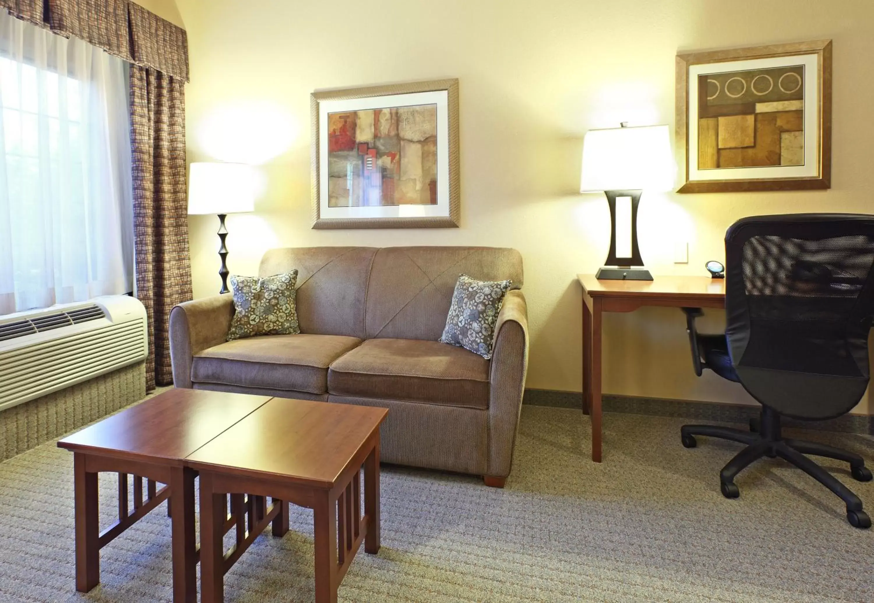 Photo of the whole room, Seating Area in Staybridge Suites Rogers - Bentonville, an IHG Hotel