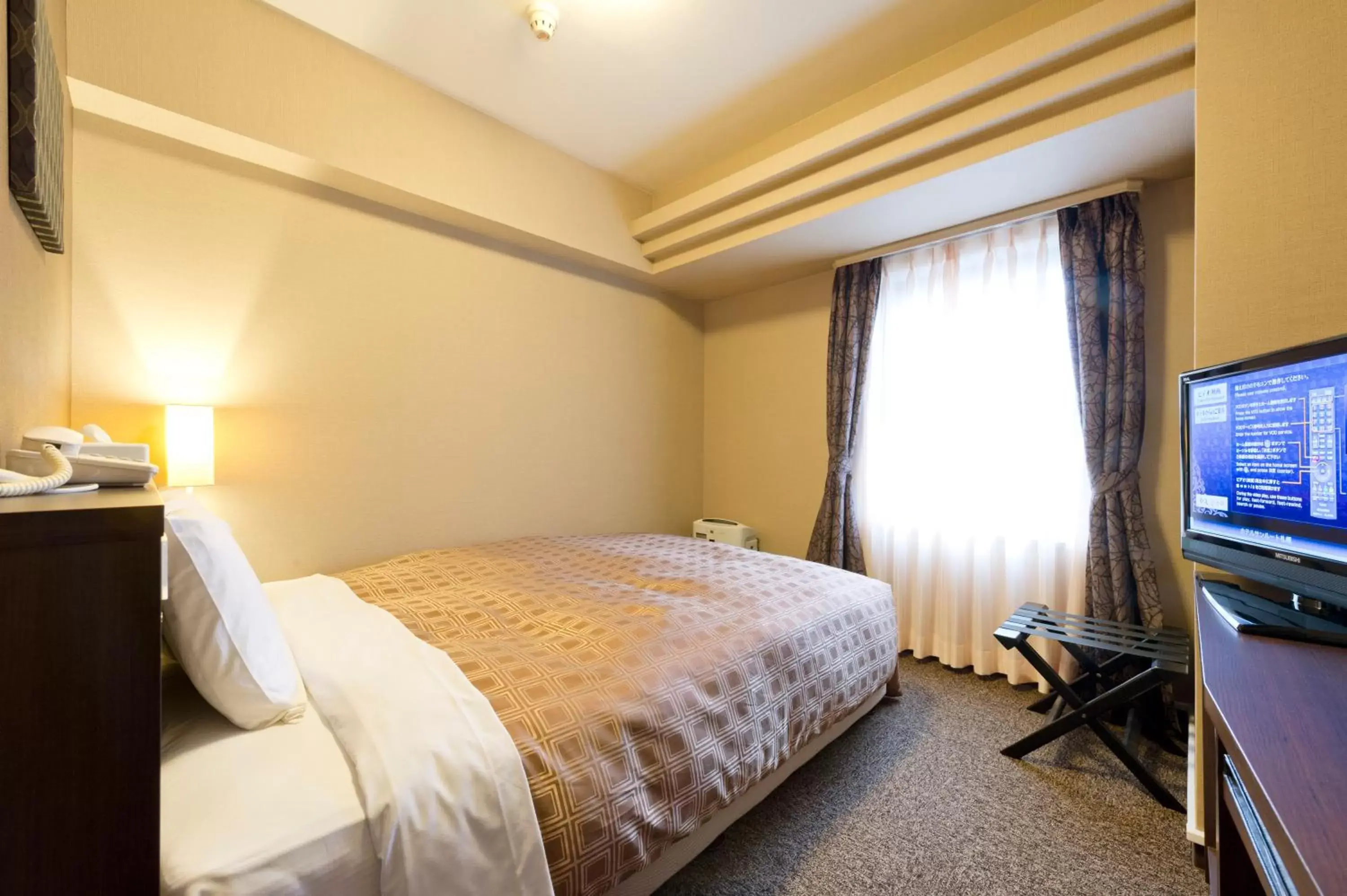 Photo of the whole room, Bed in Hotel Sunroute Sapporo