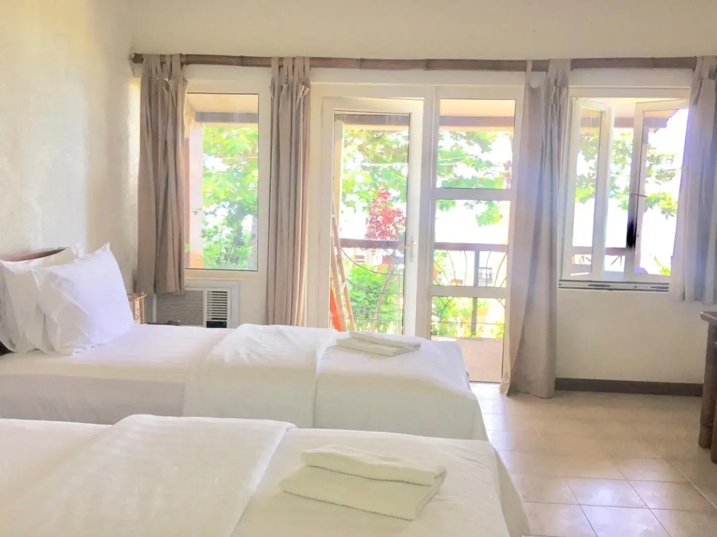 Photo of the whole room, Bed in Sunset At Aninuan Beach Resort