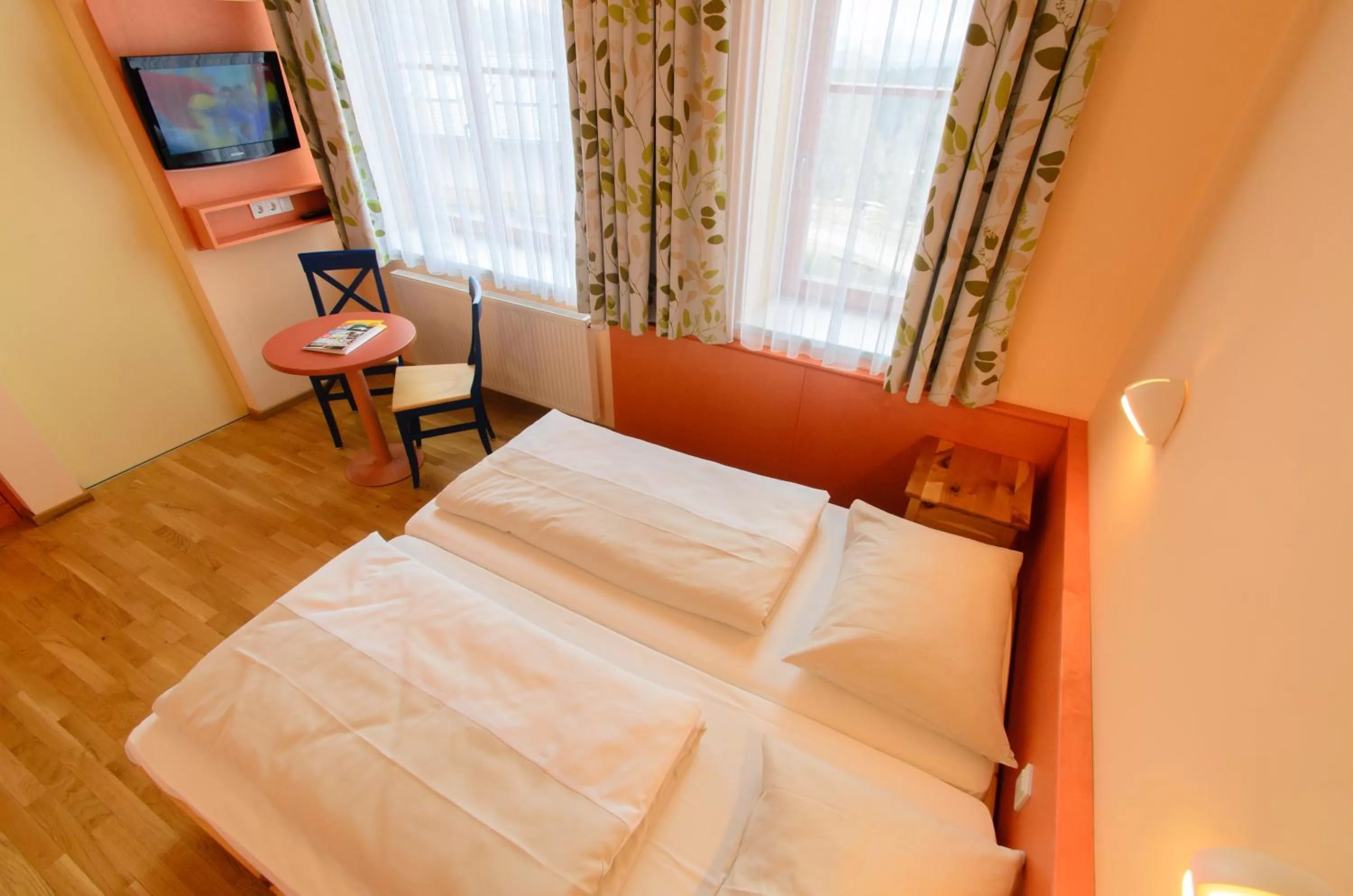 Photo of the whole room, Bed in JUFA Hotel Nockberge