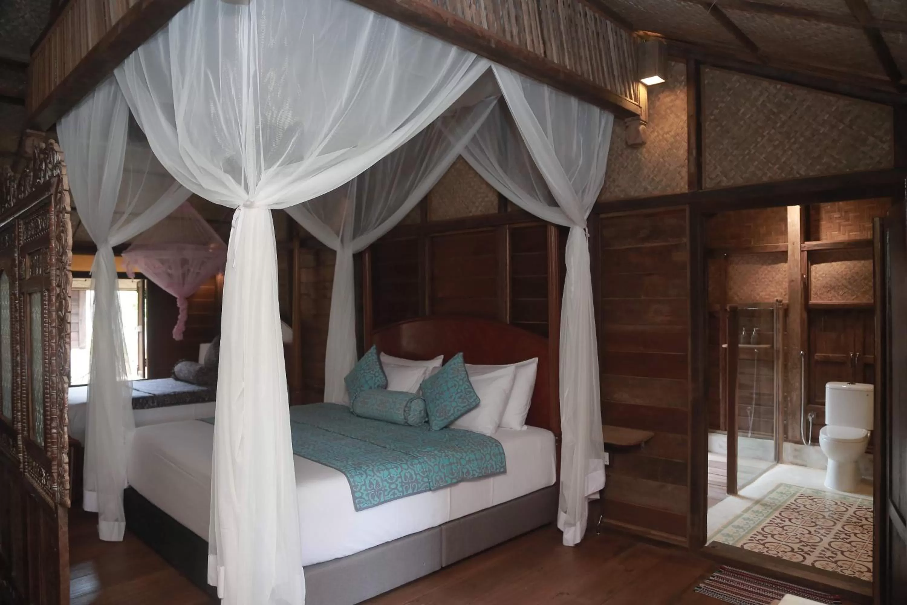 Bed in Kunang Kunang Heritage Villas