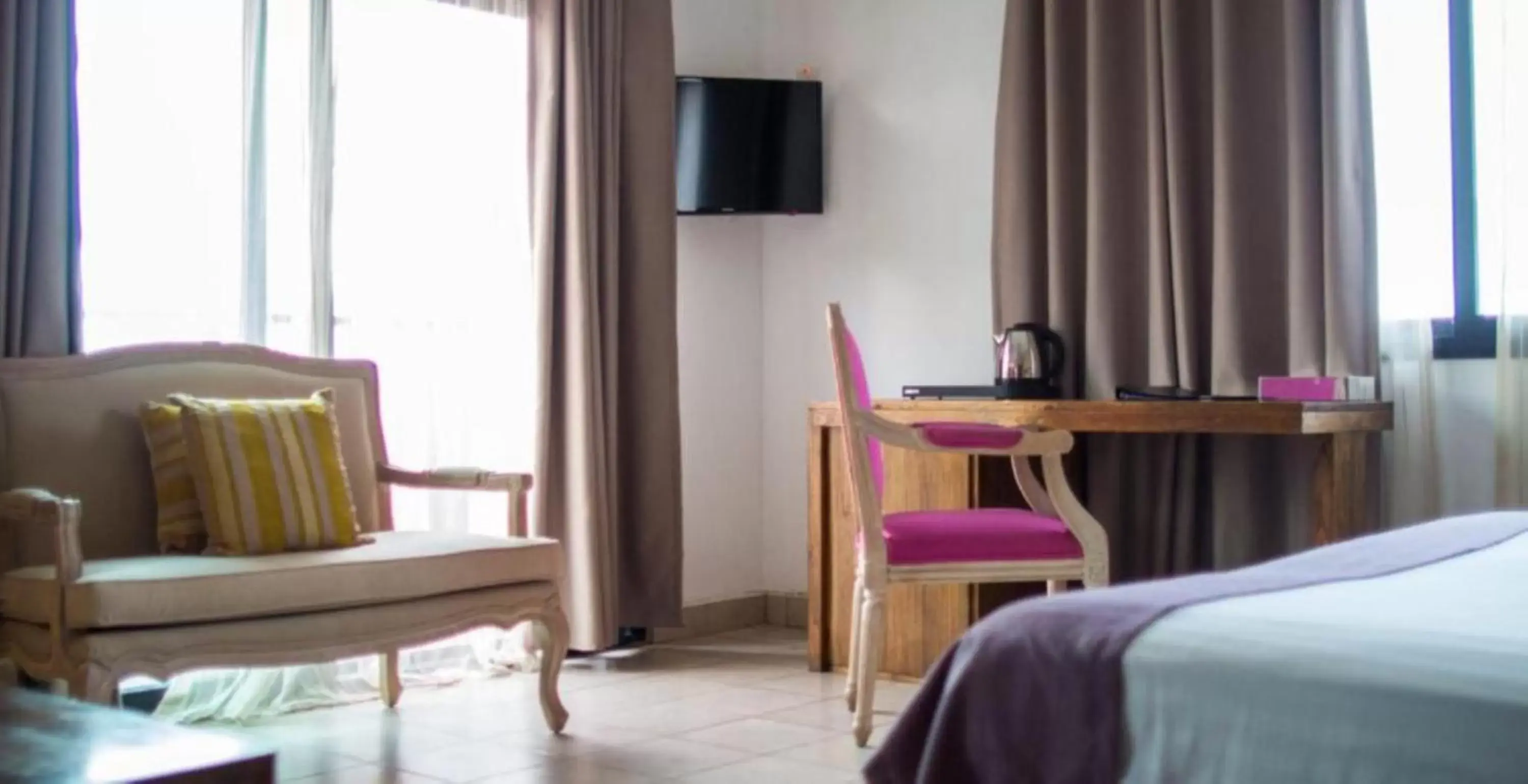 Seating area, TV/Entertainment Center in The Swiss Hotel Freetown