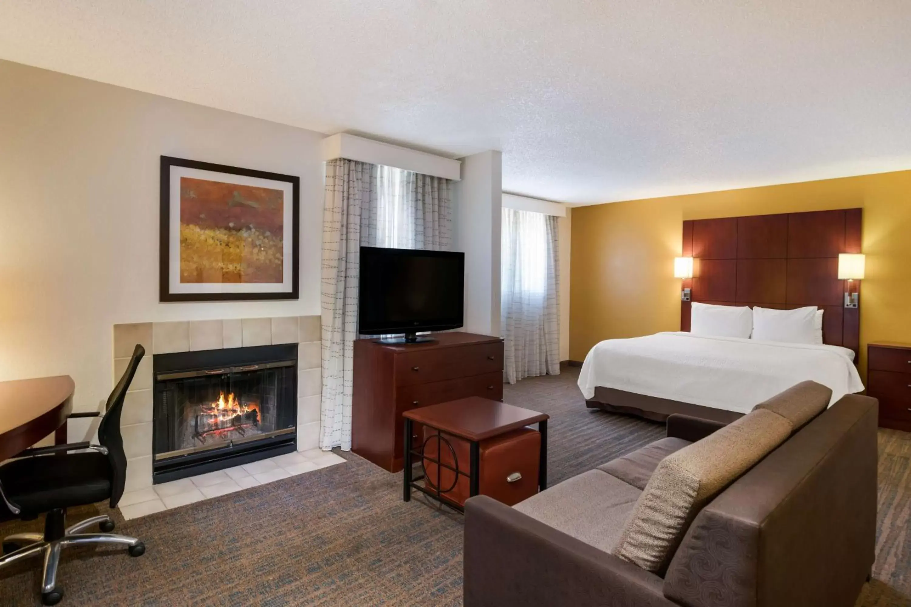 Bedroom, TV/Entertainment Center in SenS Suites Livermore; SureStay Collection by Best Western