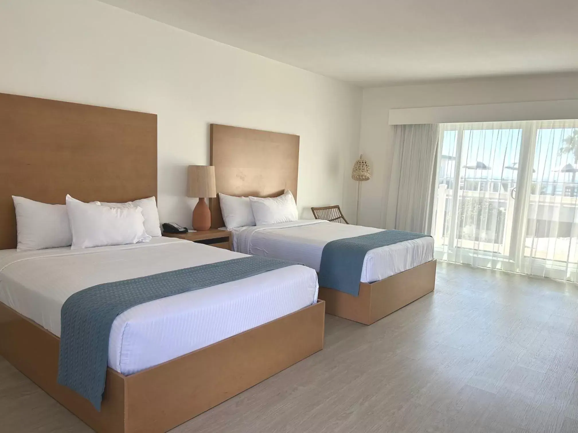 Queen Room with Two Queen Beds - Ocean View in Capri Laguna on the Beach - A Boutique Hotel Queen Room with Two Queen Beds - Ocean View in Capri Laguna on the Beach - A Boutique Hotel