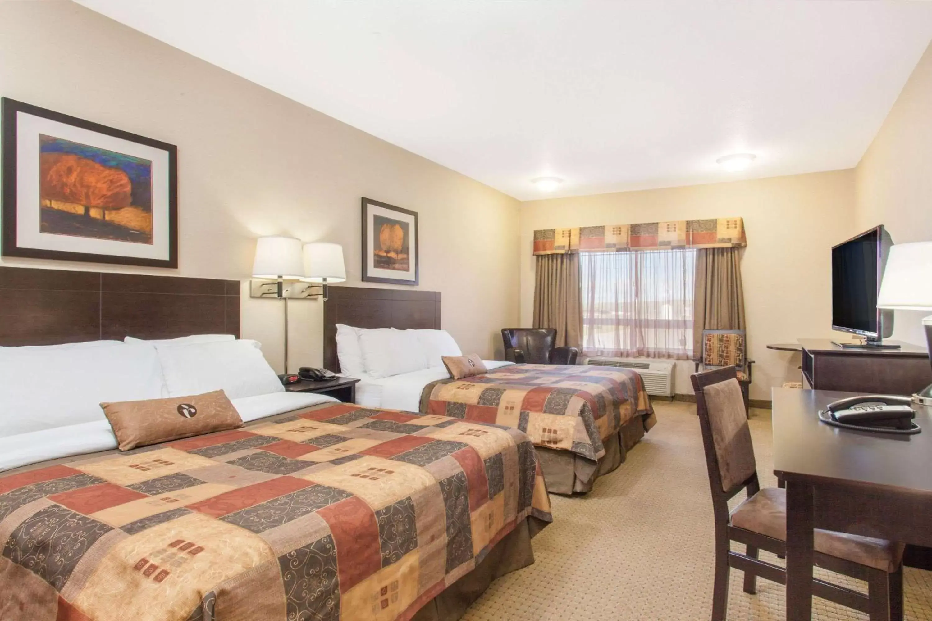Photo of the whole room, Bed in Ramada by Wyndham Pincher Creek