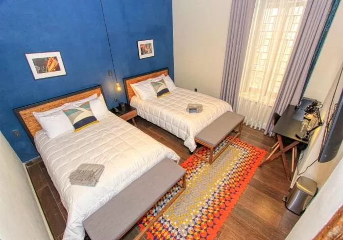 Bed in Antigua Trece Hotel Fusión