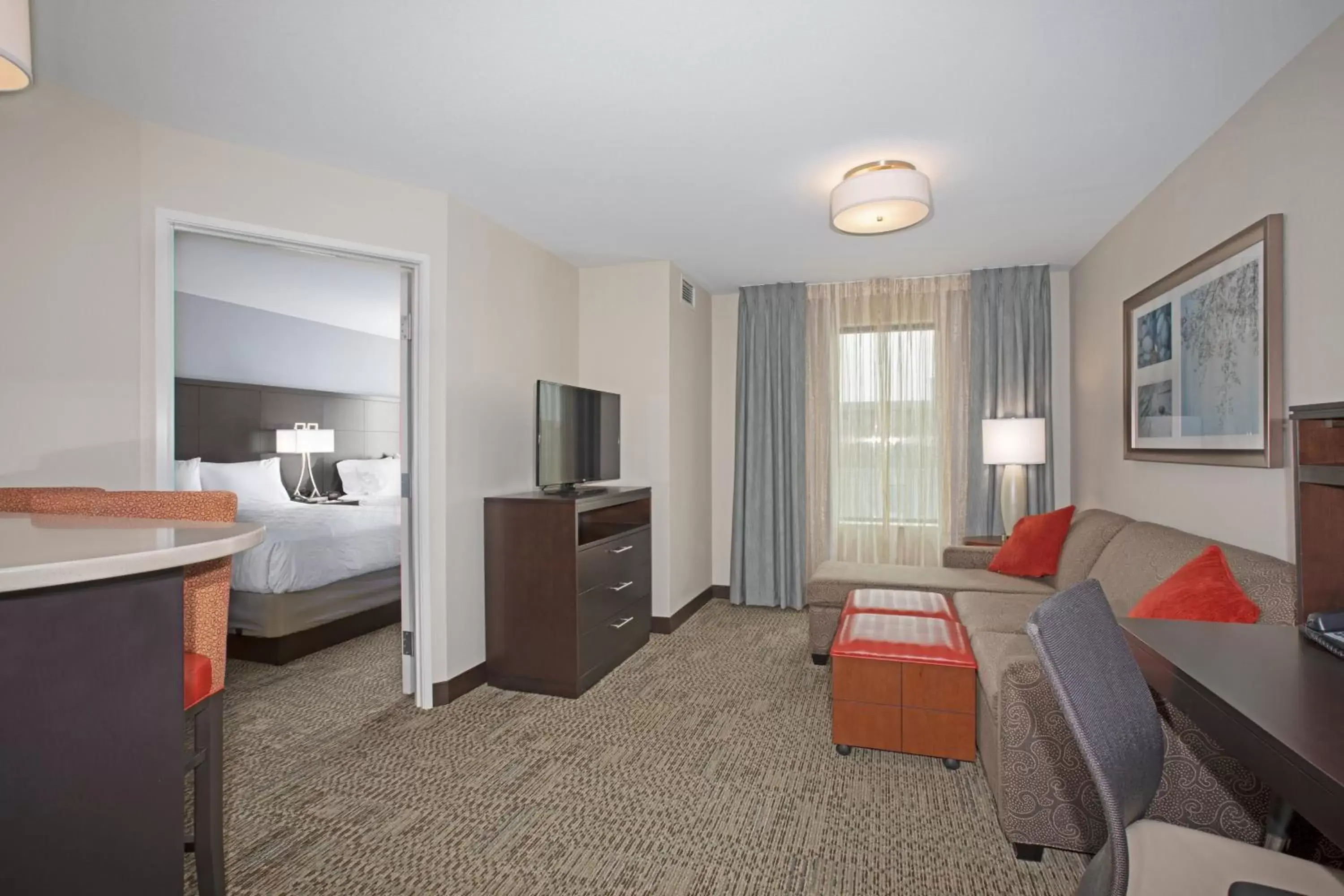 Bedroom, Seating Area in Staybridge Suites Denver South - Highlands Ranch, an IHG Hotel