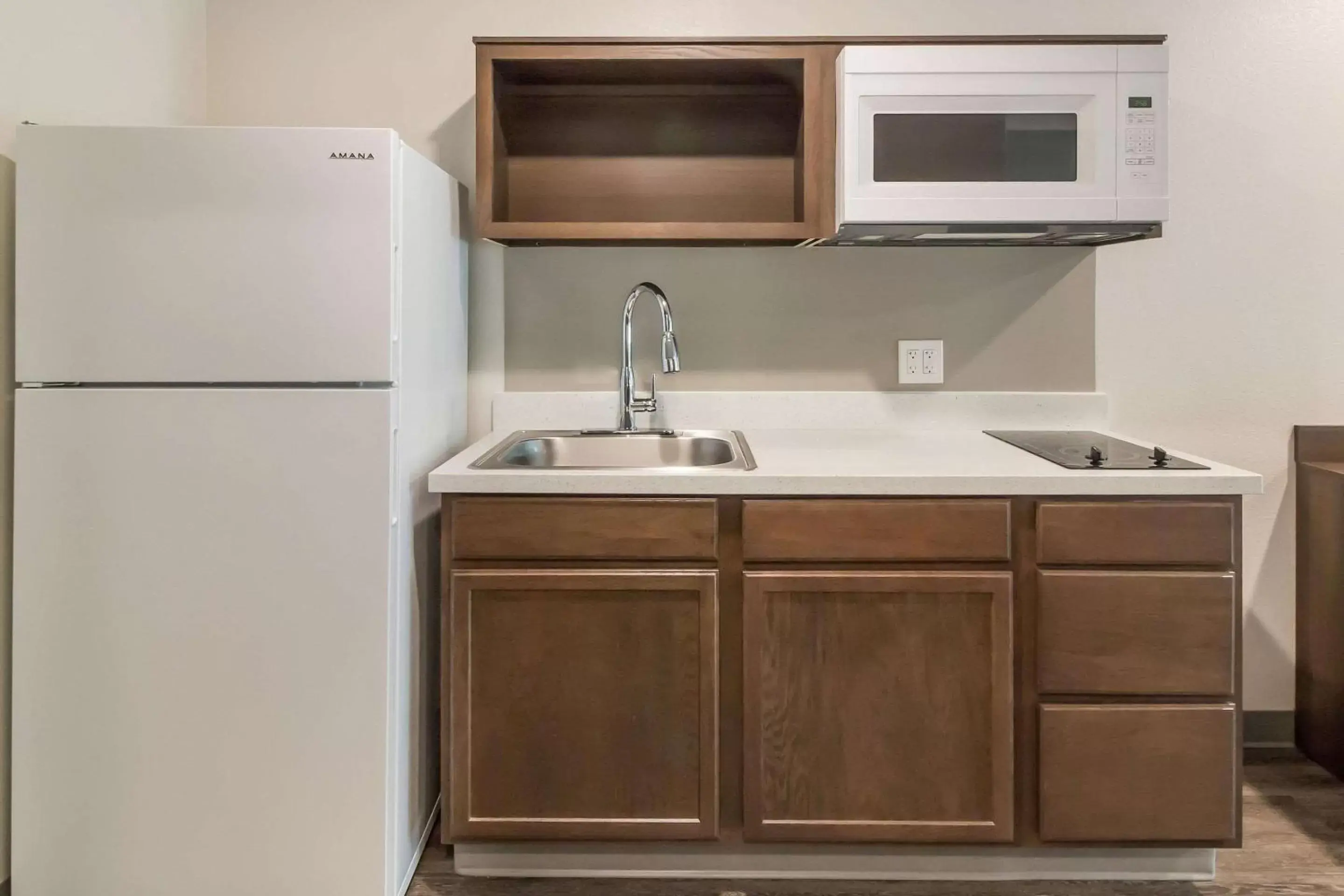 Photo of the whole room, Kitchen/Kitchenette in WoodSpring Suites Lake Jackson