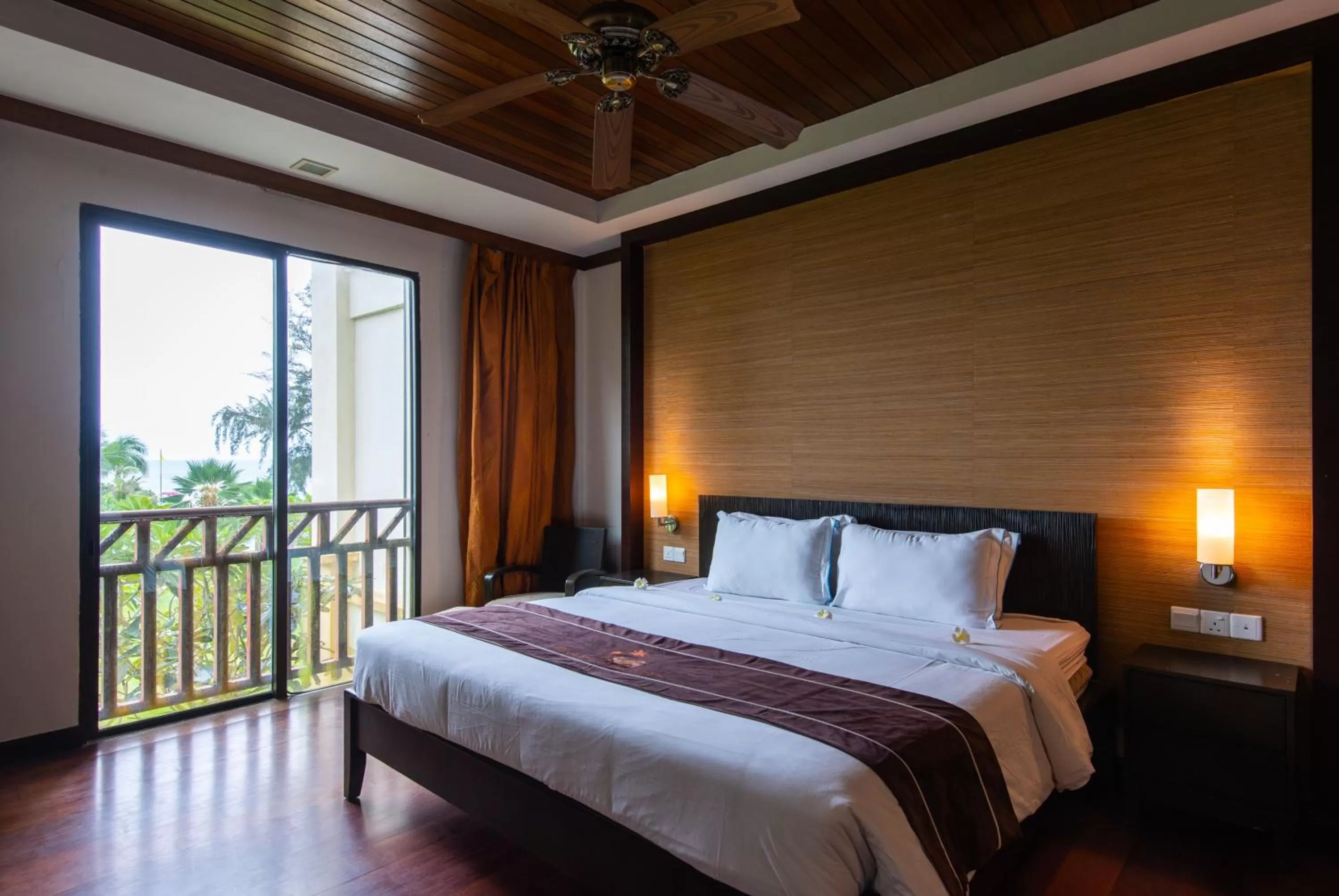Bed in Sabah Beach Villas & Suites