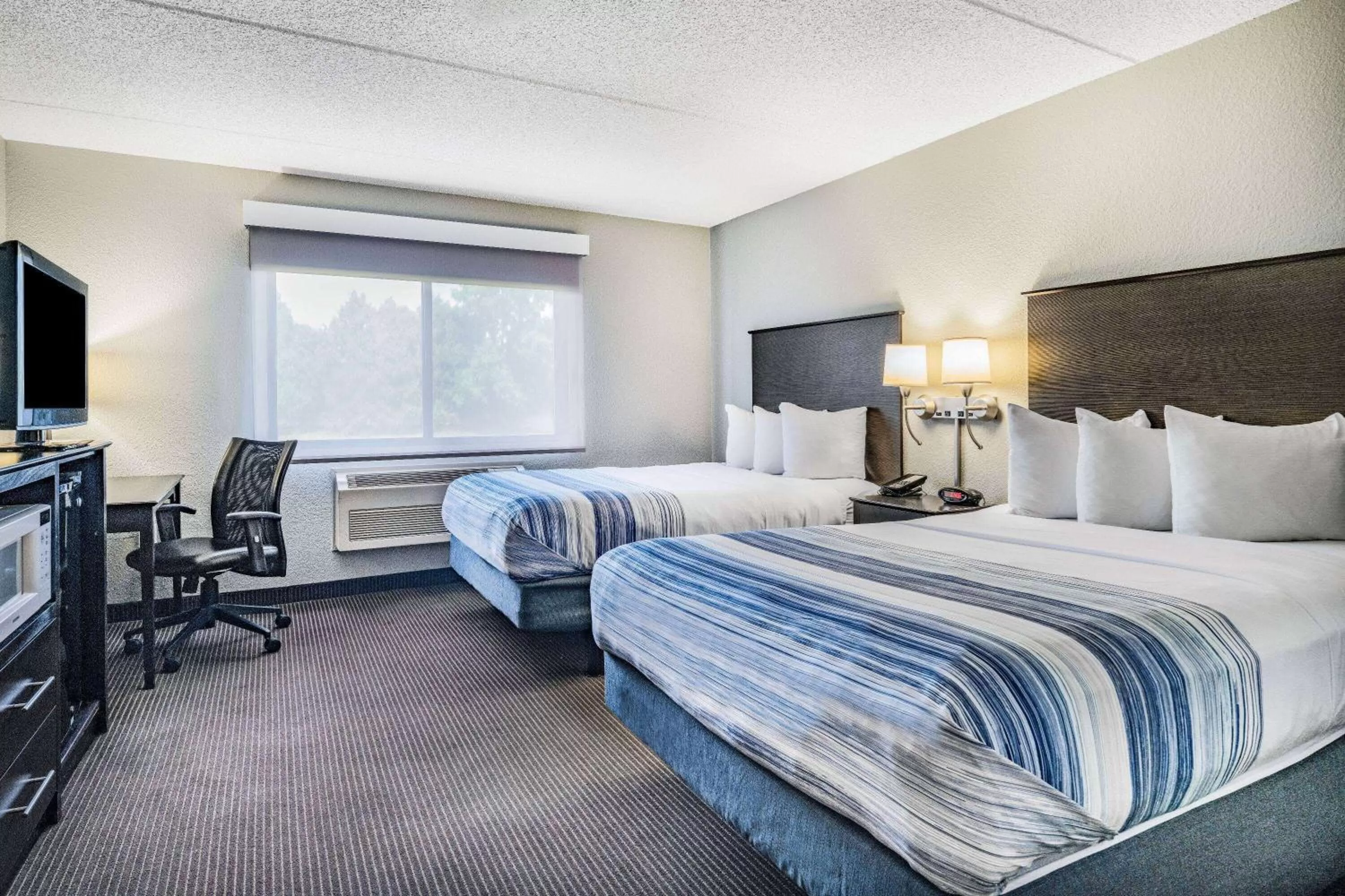 Photo of the whole room, Bed in AmericInn by Wyndham Plover Stevens Point