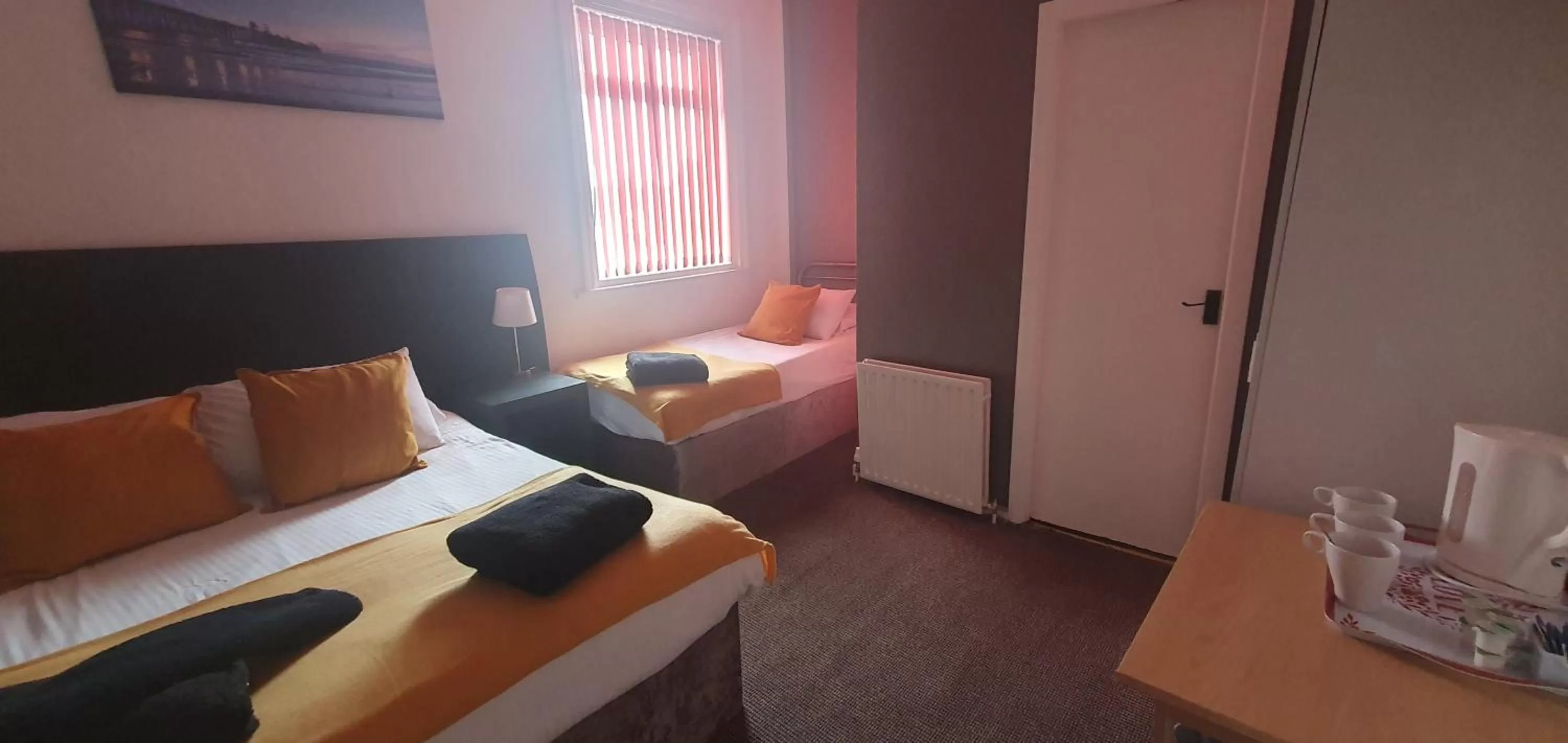 Bed in Palm Beach Hotel by the Sea