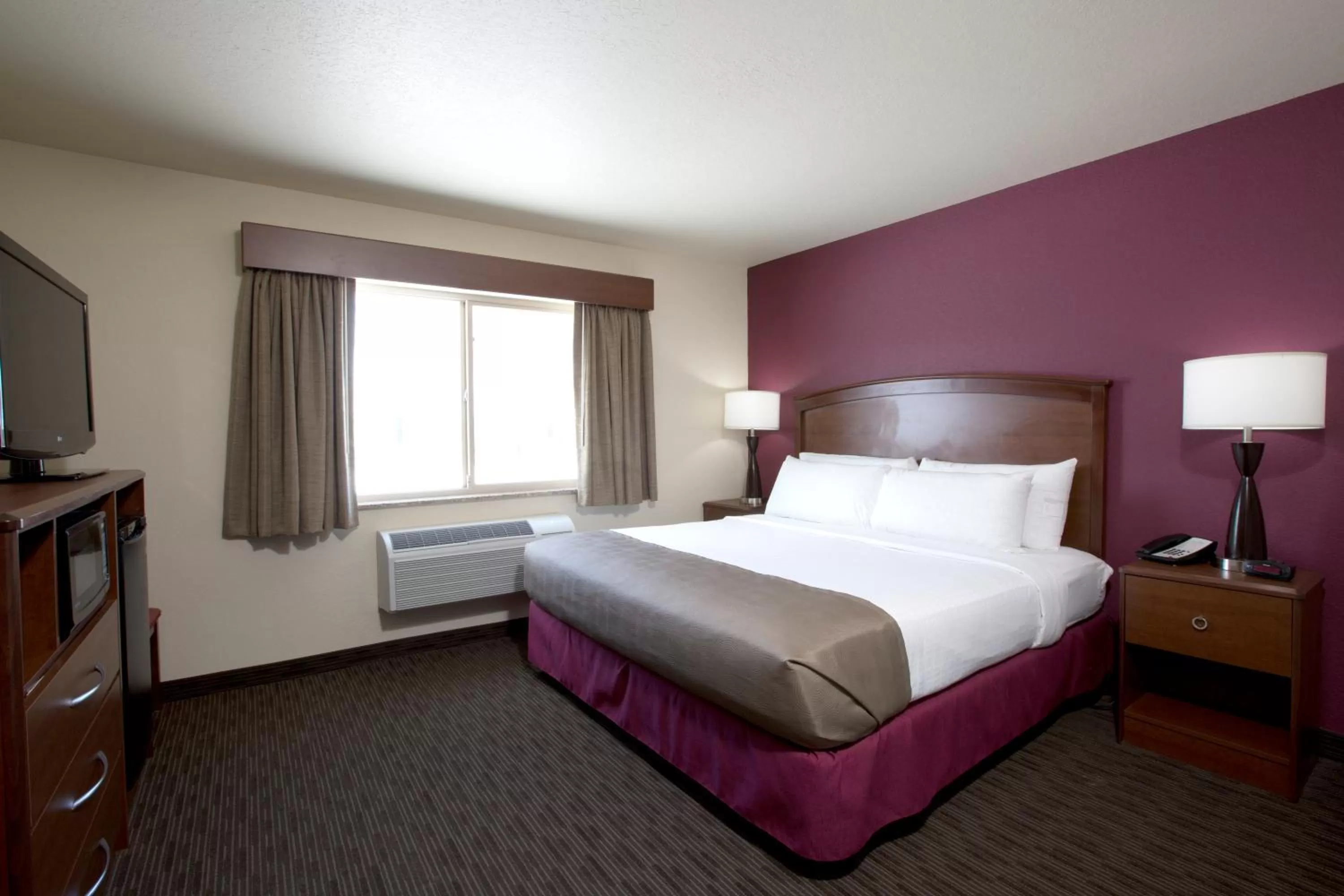 Bed in AmericInn by Wyndham Medora