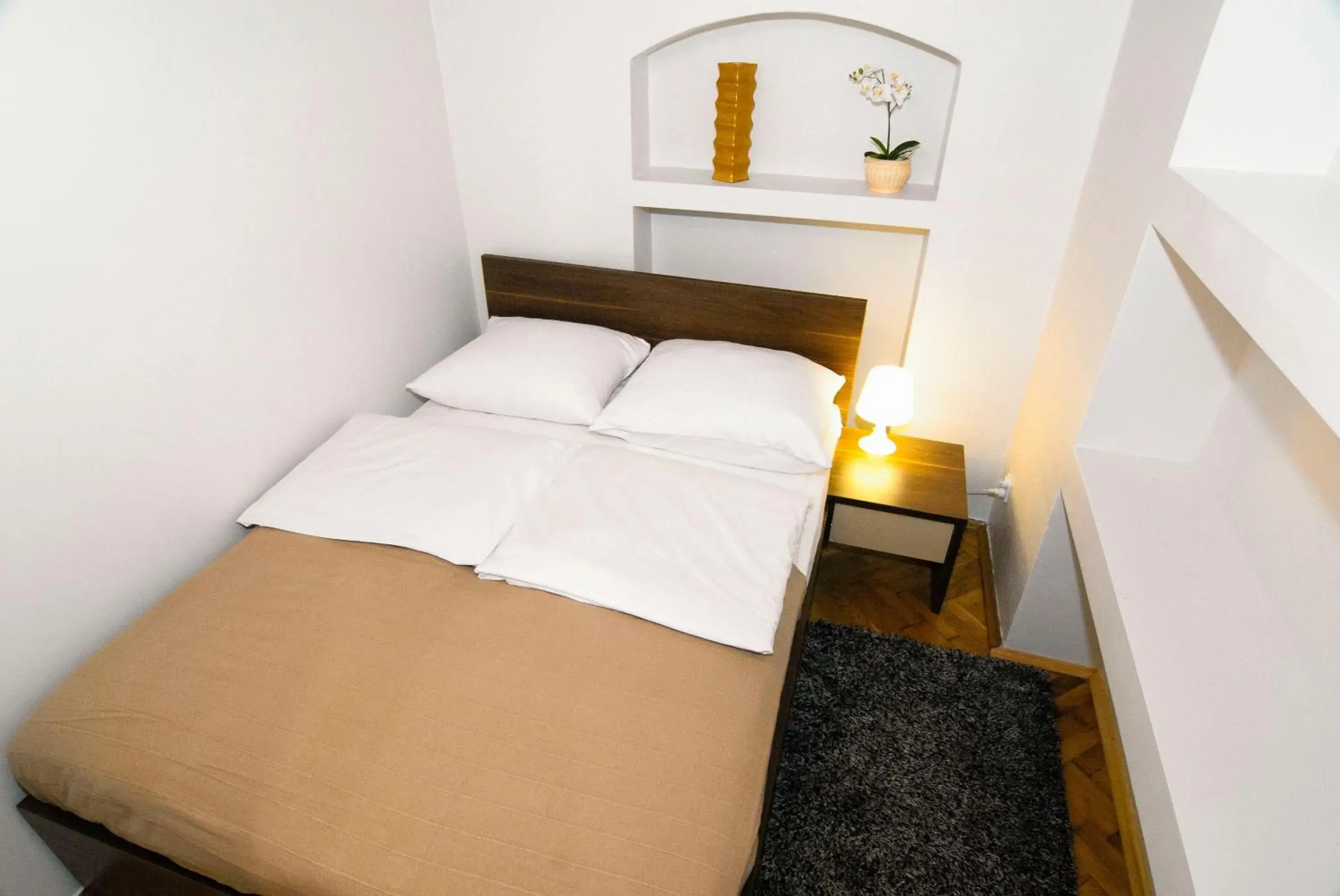 Bed in P&J Tourist Apartments