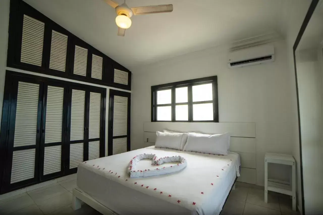 Bed in Beach Front TGR Hotels and Resorts