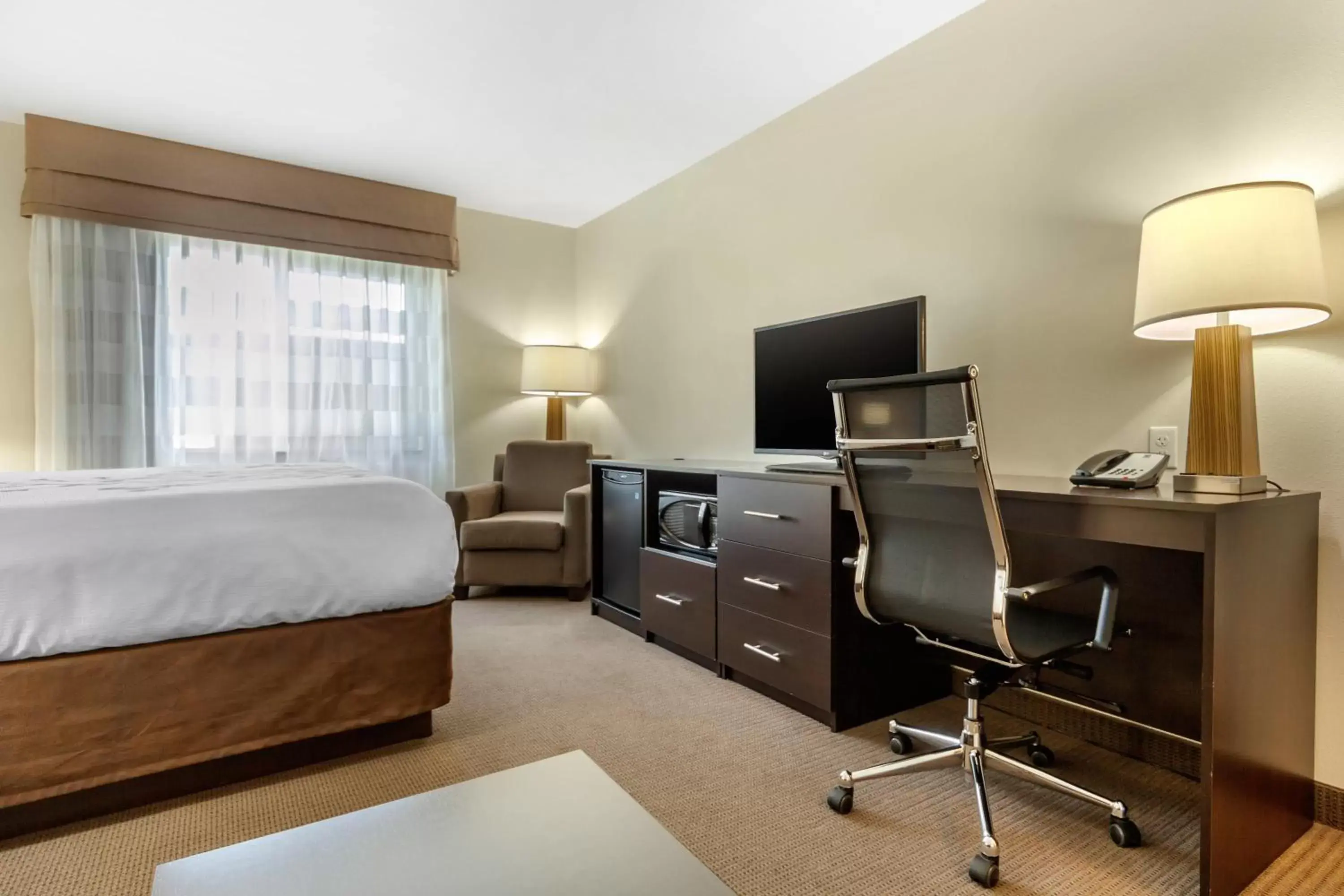 Photo of the whole room, TV/Entertainment Center in Sleep Inn & Suites Devils Lake