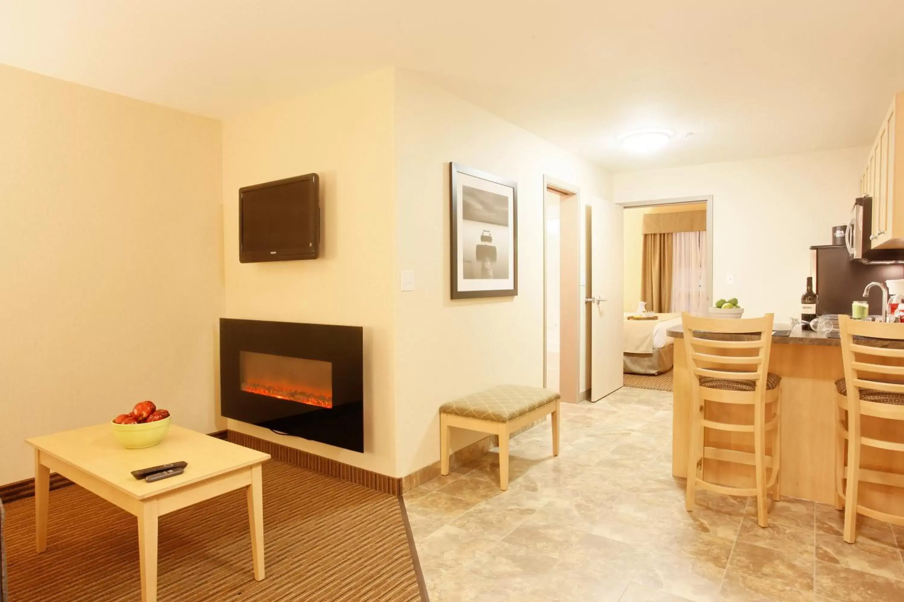 Living room, TV/Entertainment Center in Vegreville Suites