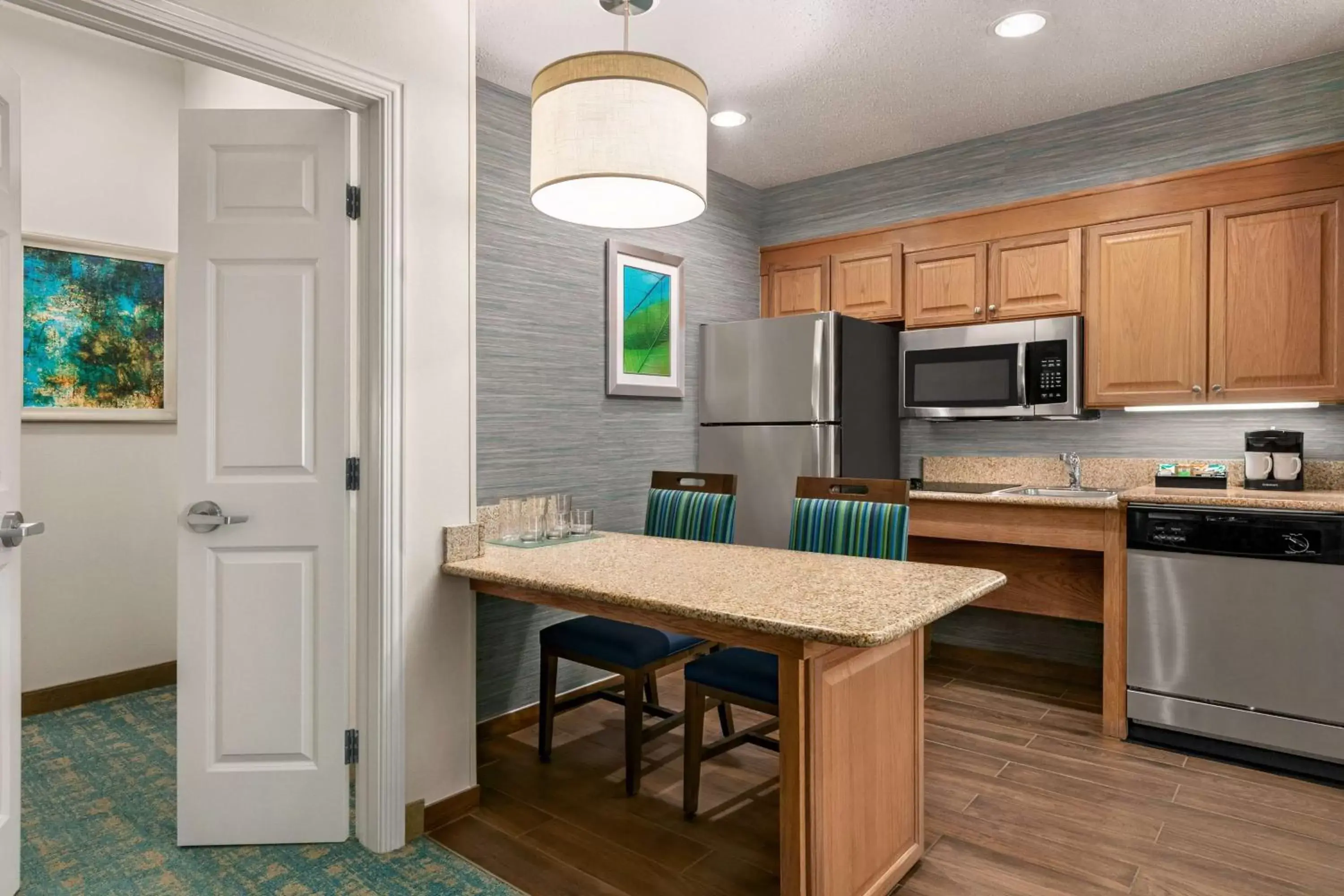 Bedroom, Kitchen/Kitchenette in Homewood Suites by Hilton Fort Myers