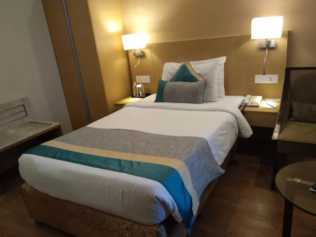 Bed in Sarovar Portico Rivera Ahmedabad