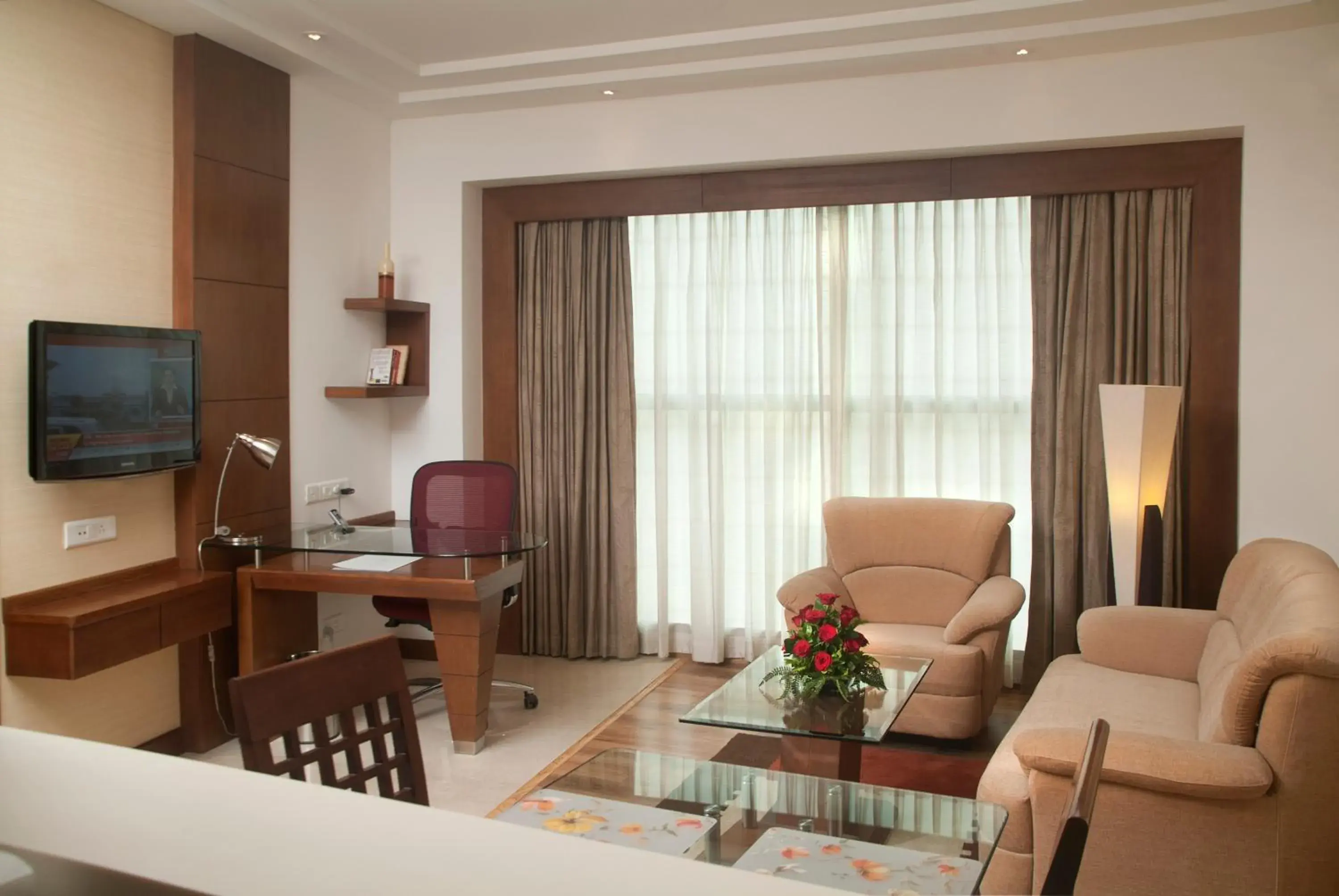 TV and multimedia, Seating Area in Savoy Suites Greater Noida