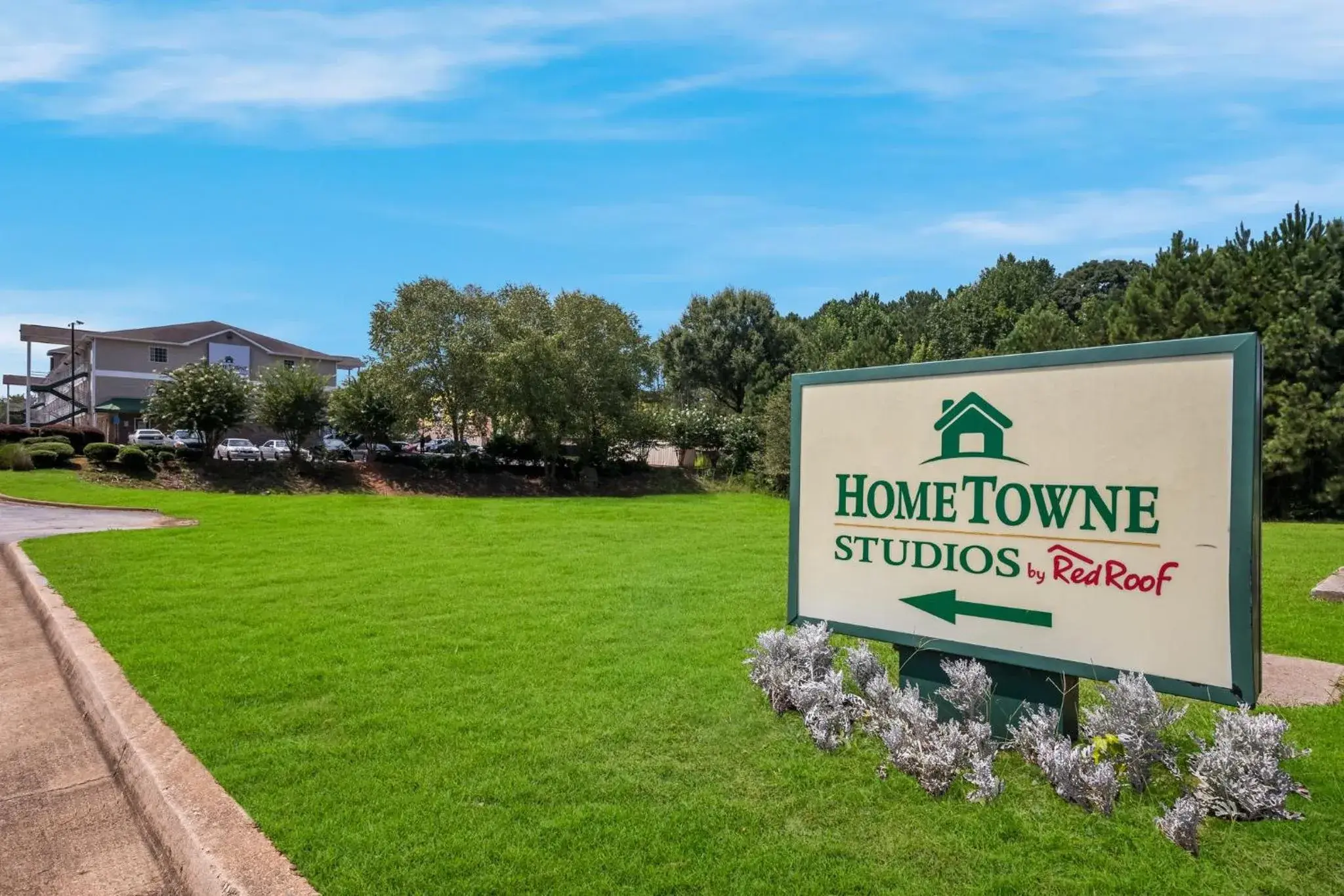 Property building in HomeTowne Studios by Red Roof Covington, GA