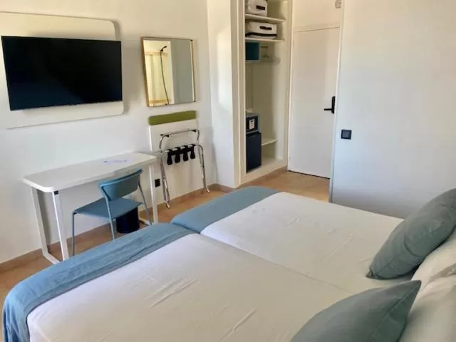 Bed in HOTEL BOUTIQUE CABO SUR