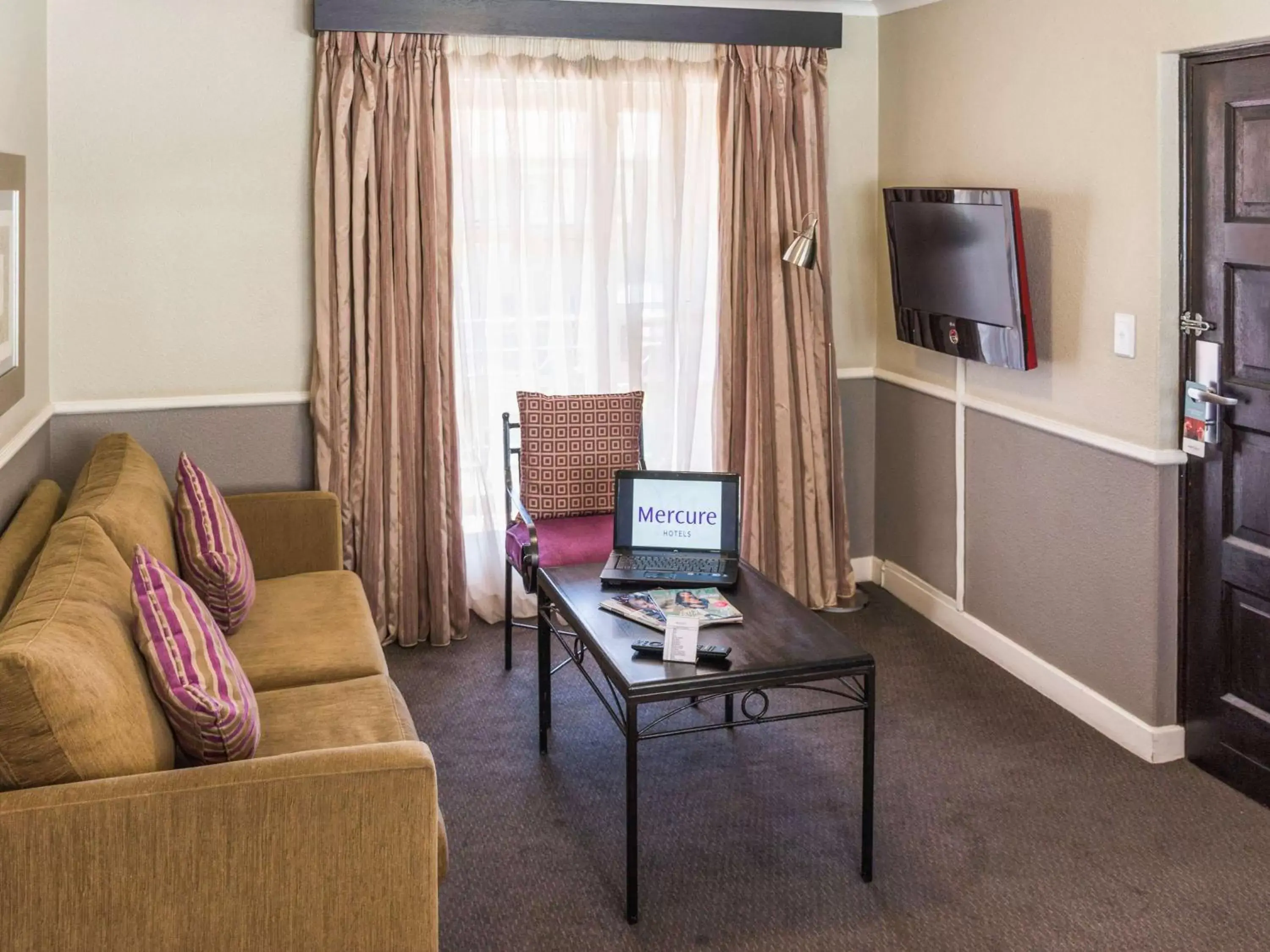 Photo of the whole room, TV/Entertainment Center in Mercure Hotel Bedfordview