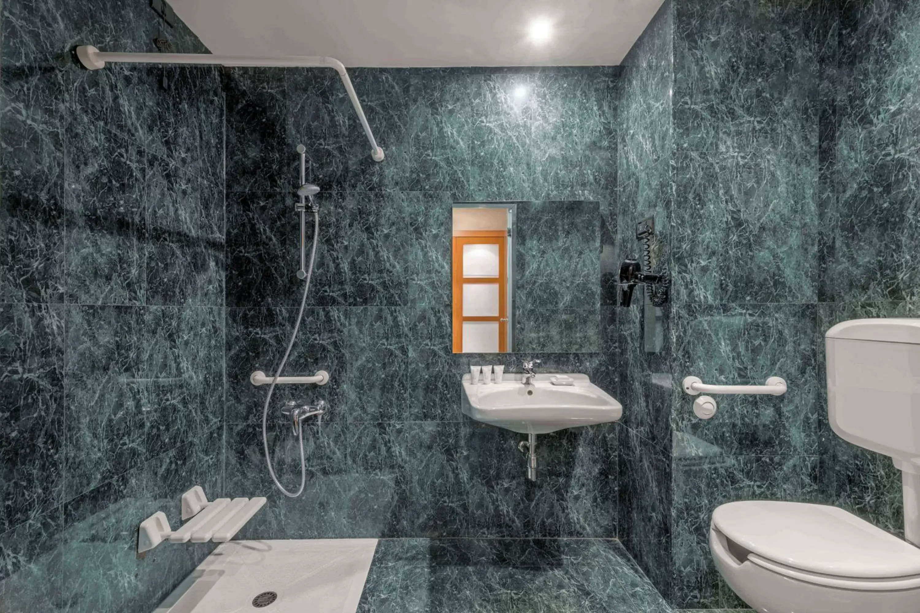Bathroom in AC Hotel Genova by Marriott