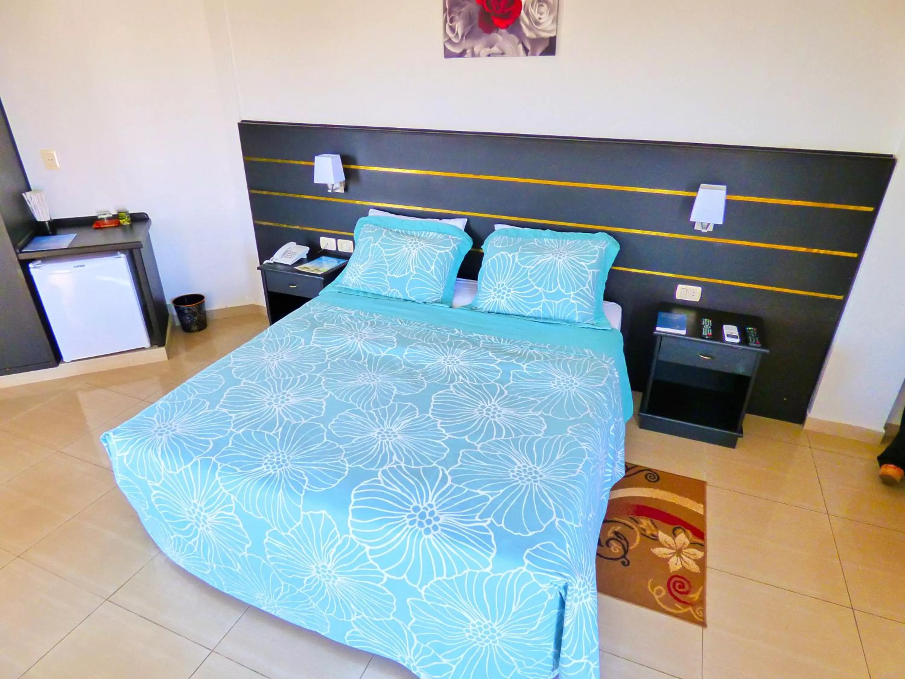 Bed in De La Costa Hotel