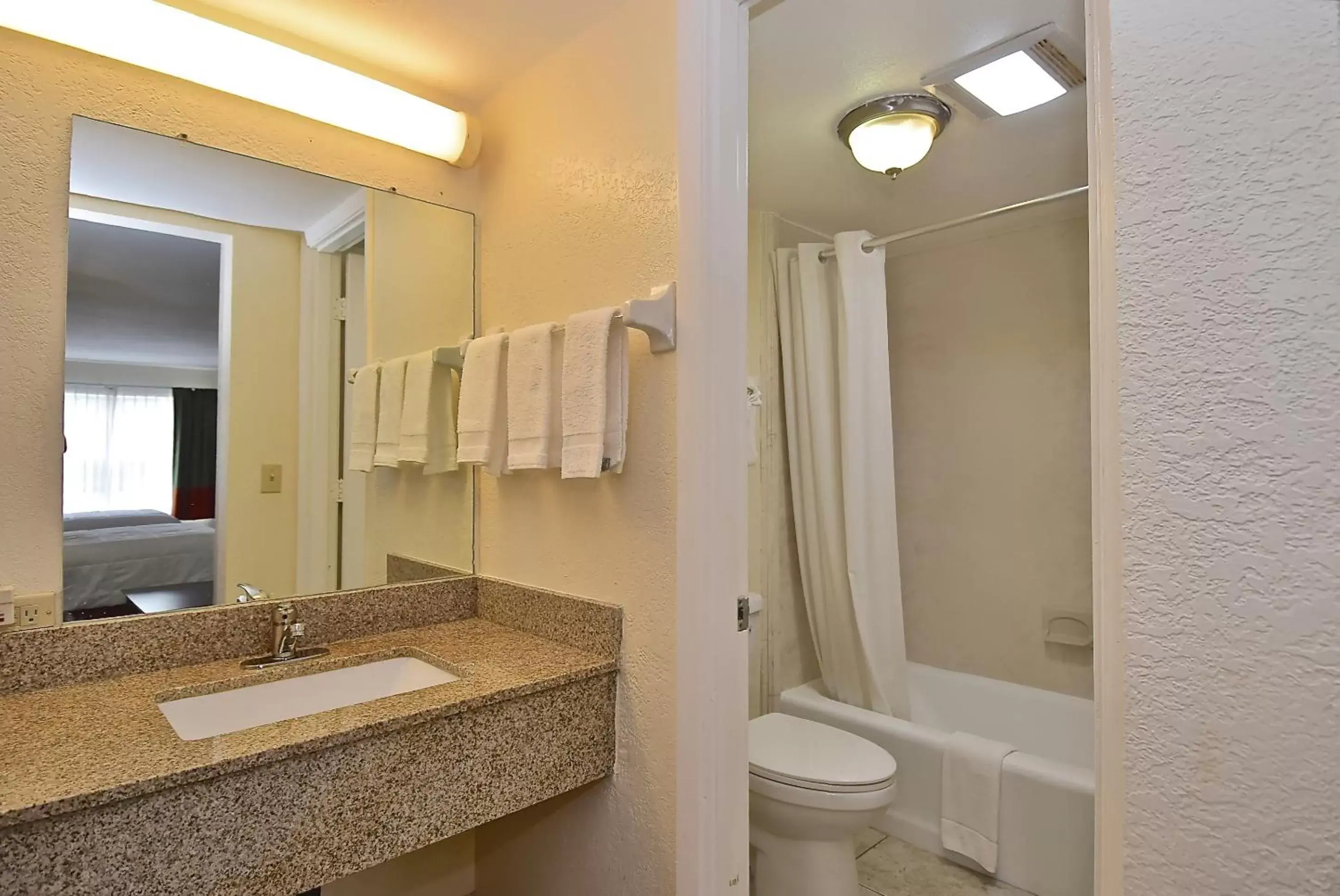 Bathroom in SureStay Hotel by Best Western Sarasota Lido Beach